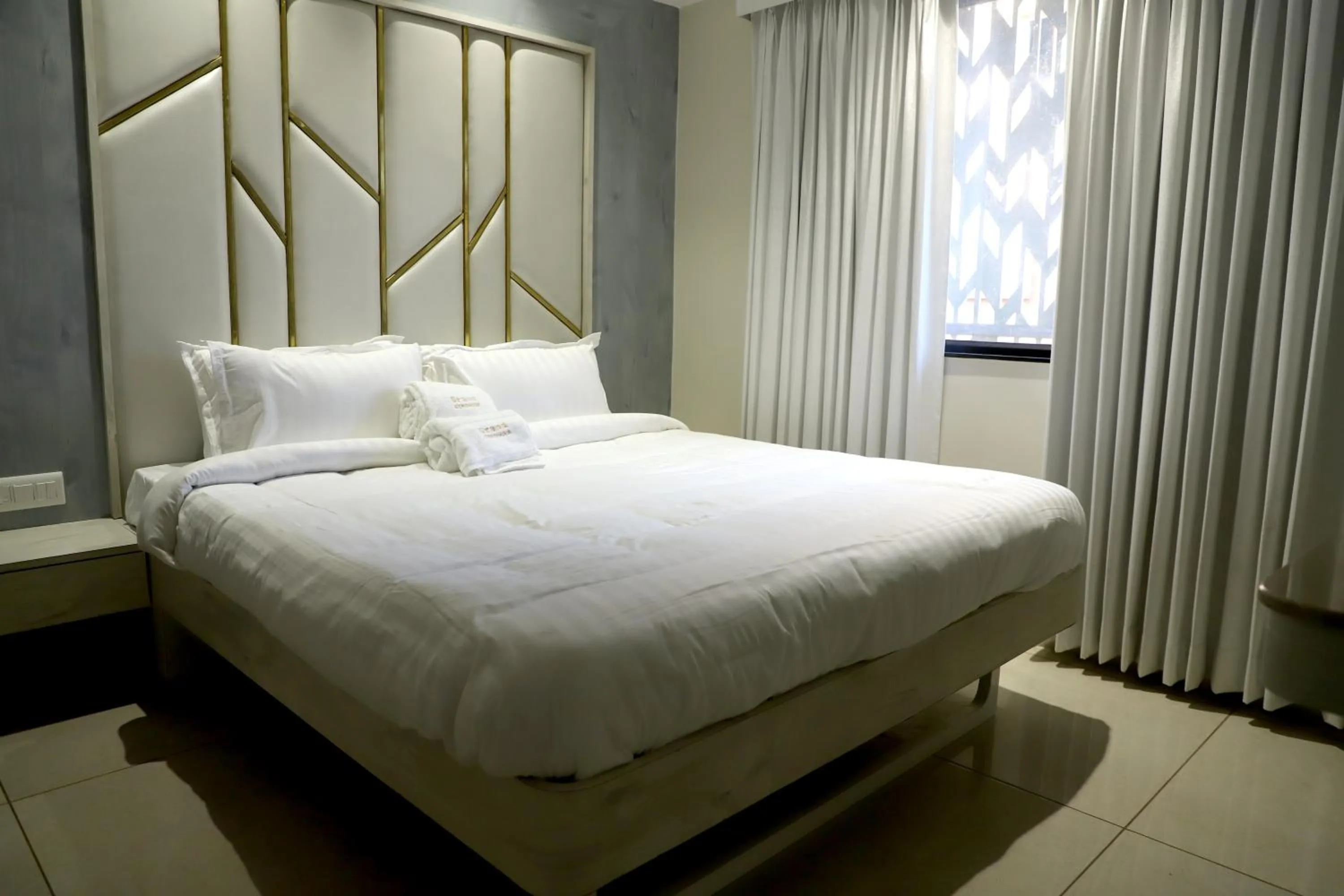 Bed in Hotel Grand Girdhar