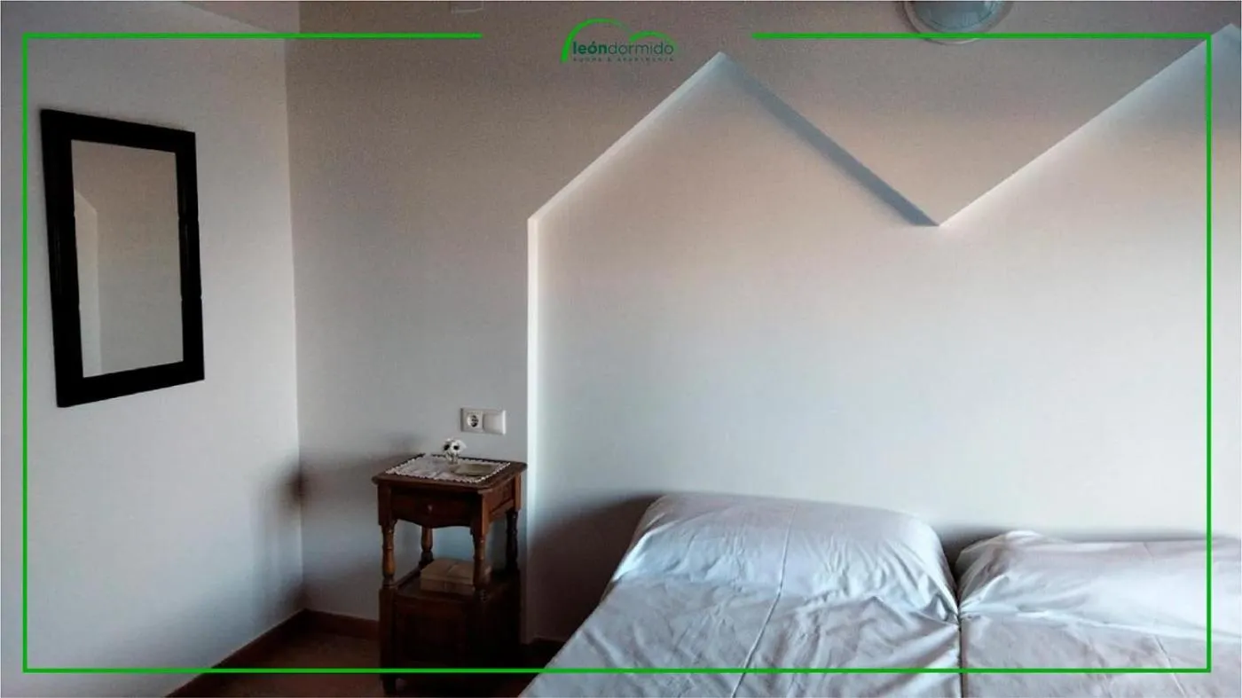 Bed in Hostal León Dormido