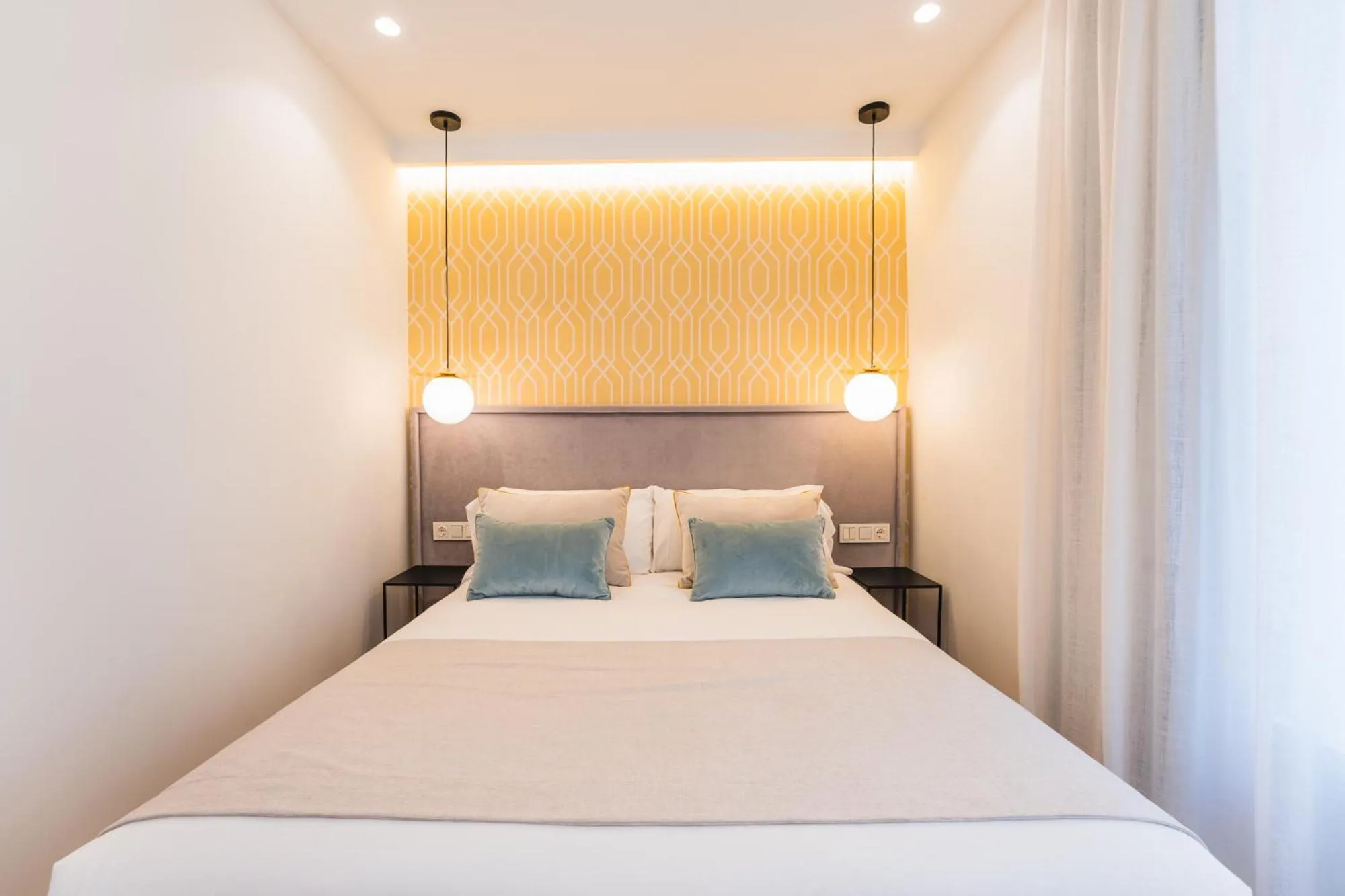 Bed in Debambú Suites