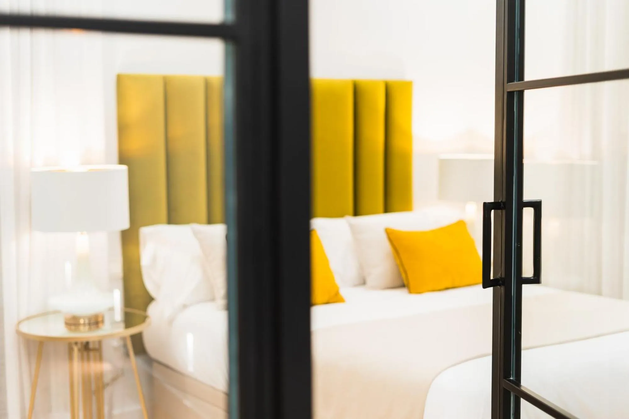 Bed in Debambú Suites