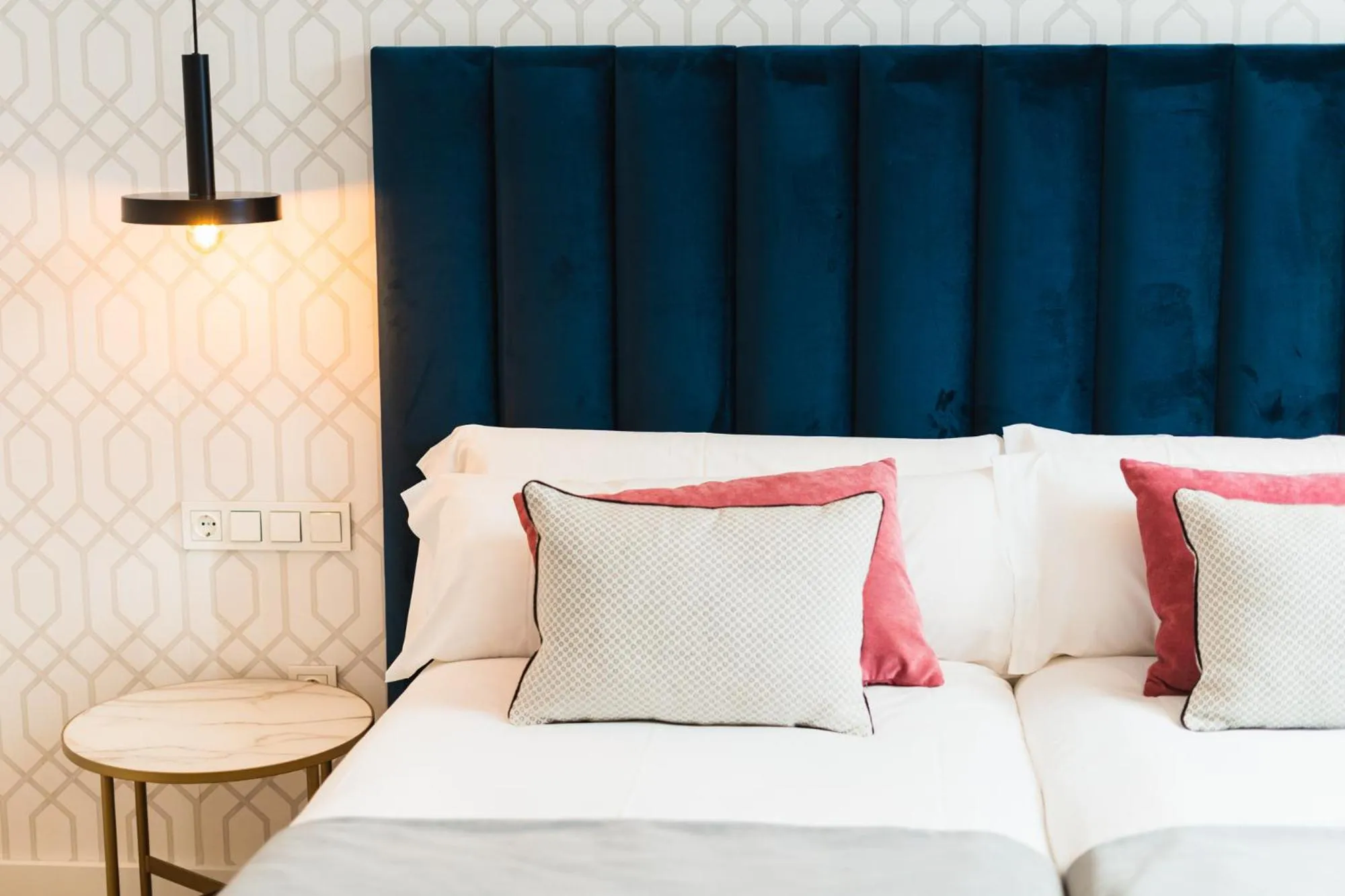 Bed in Debambú Suites