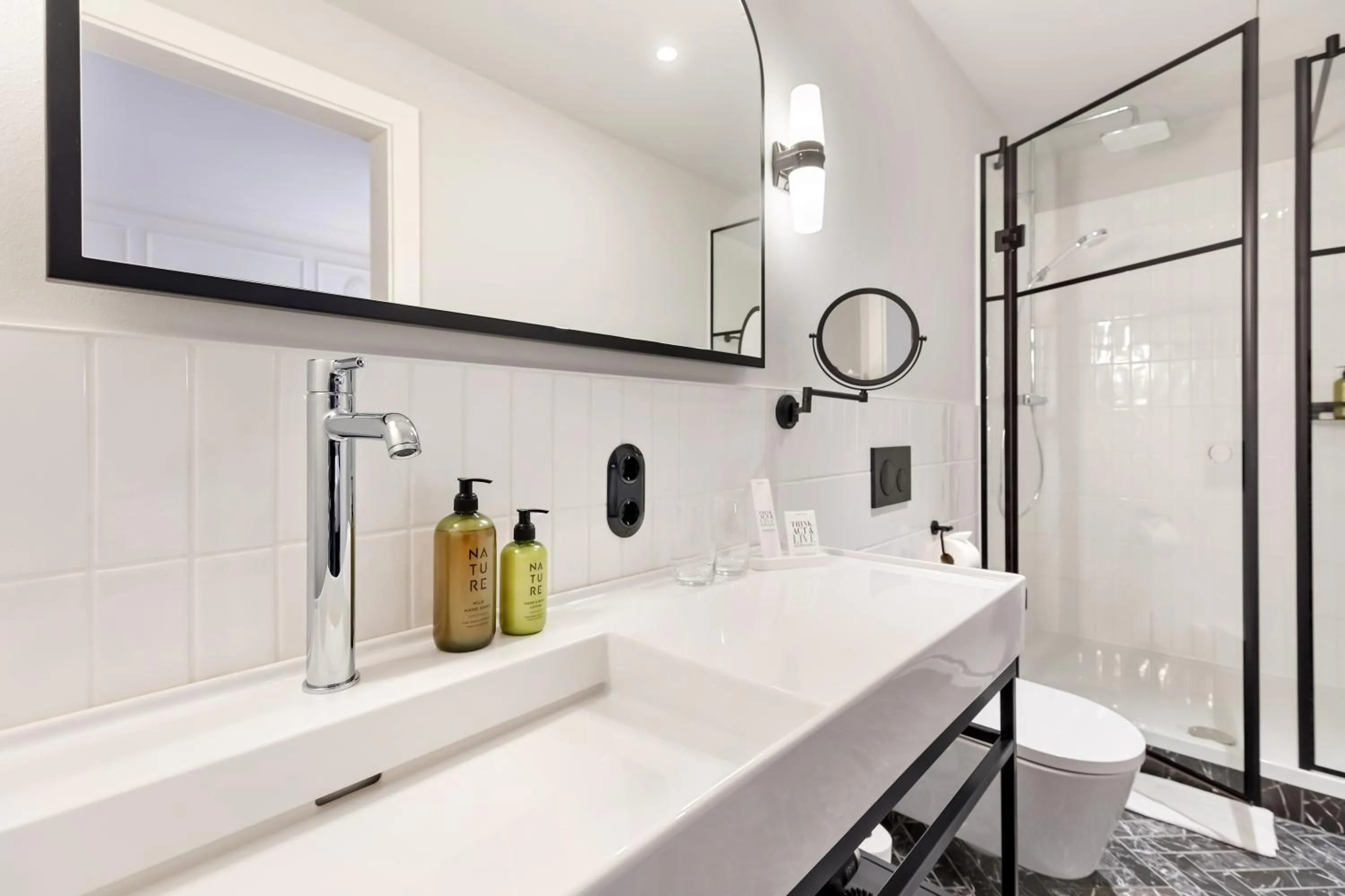 Bathroom in Hotel Astoria Vienna, Curio Collection by Hilton