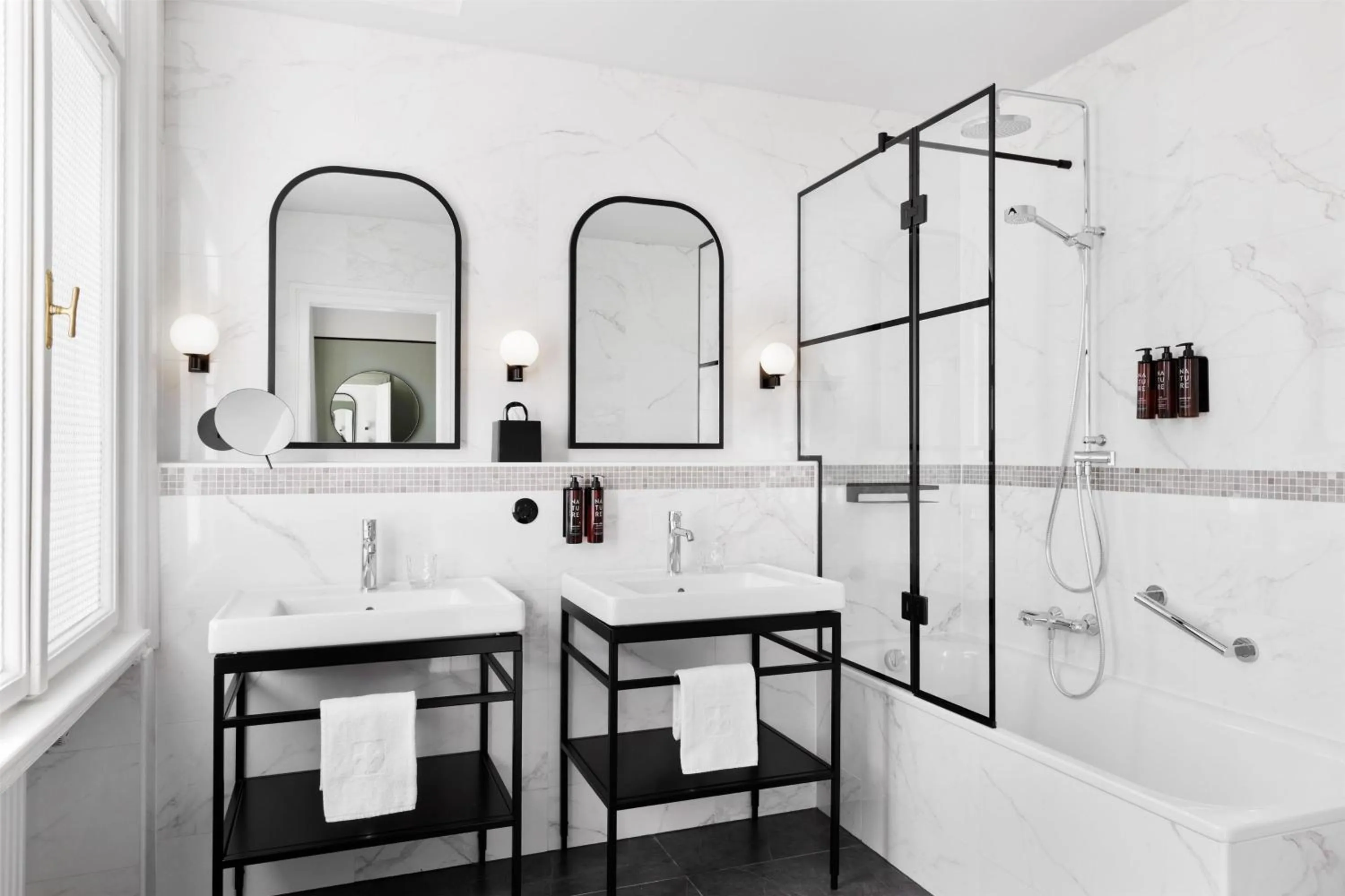 Bathroom in Hotel Astoria Vienna, Curio Collection by Hilton