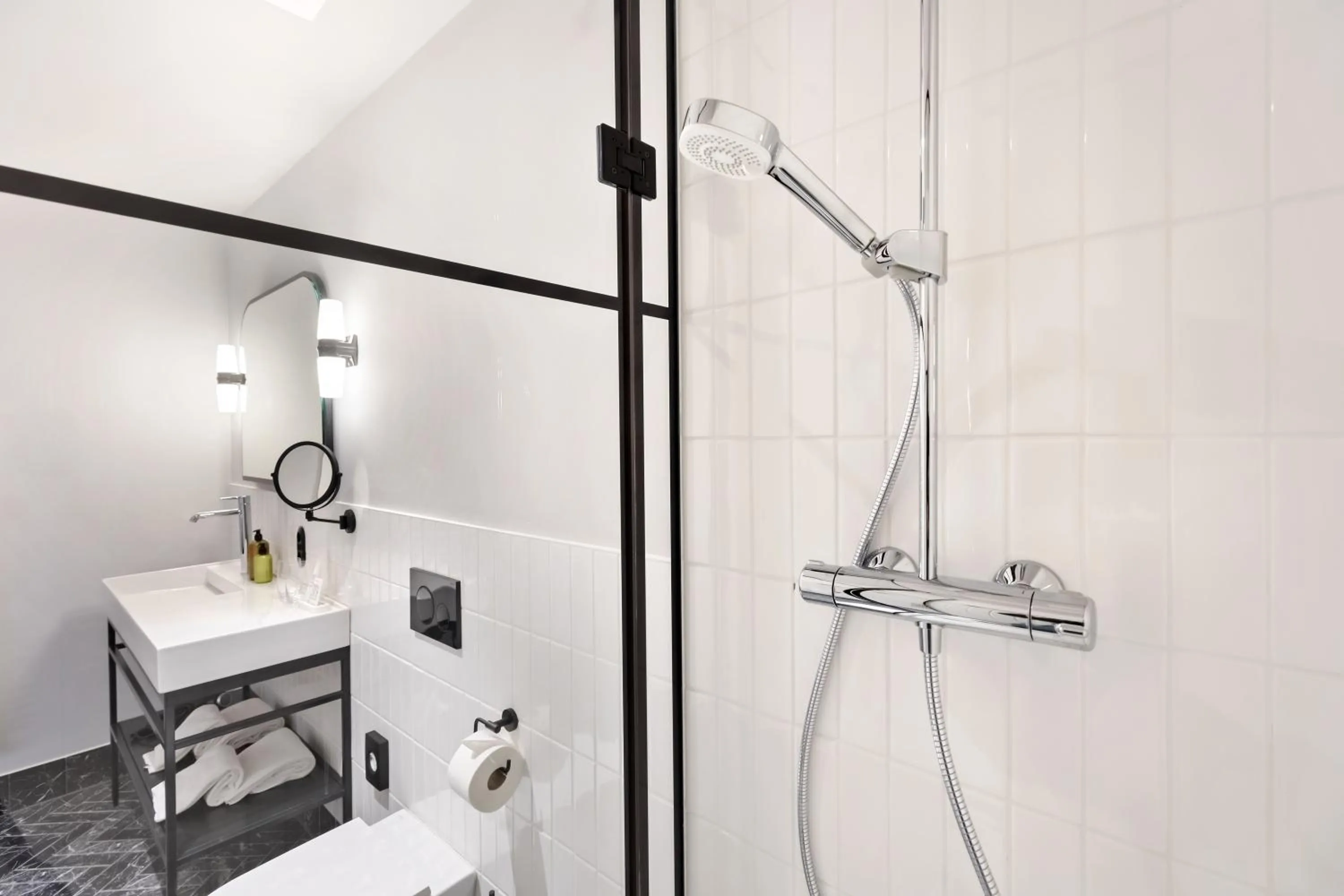 Bathroom in Hotel Astoria Vienna, Curio Collection by Hilton