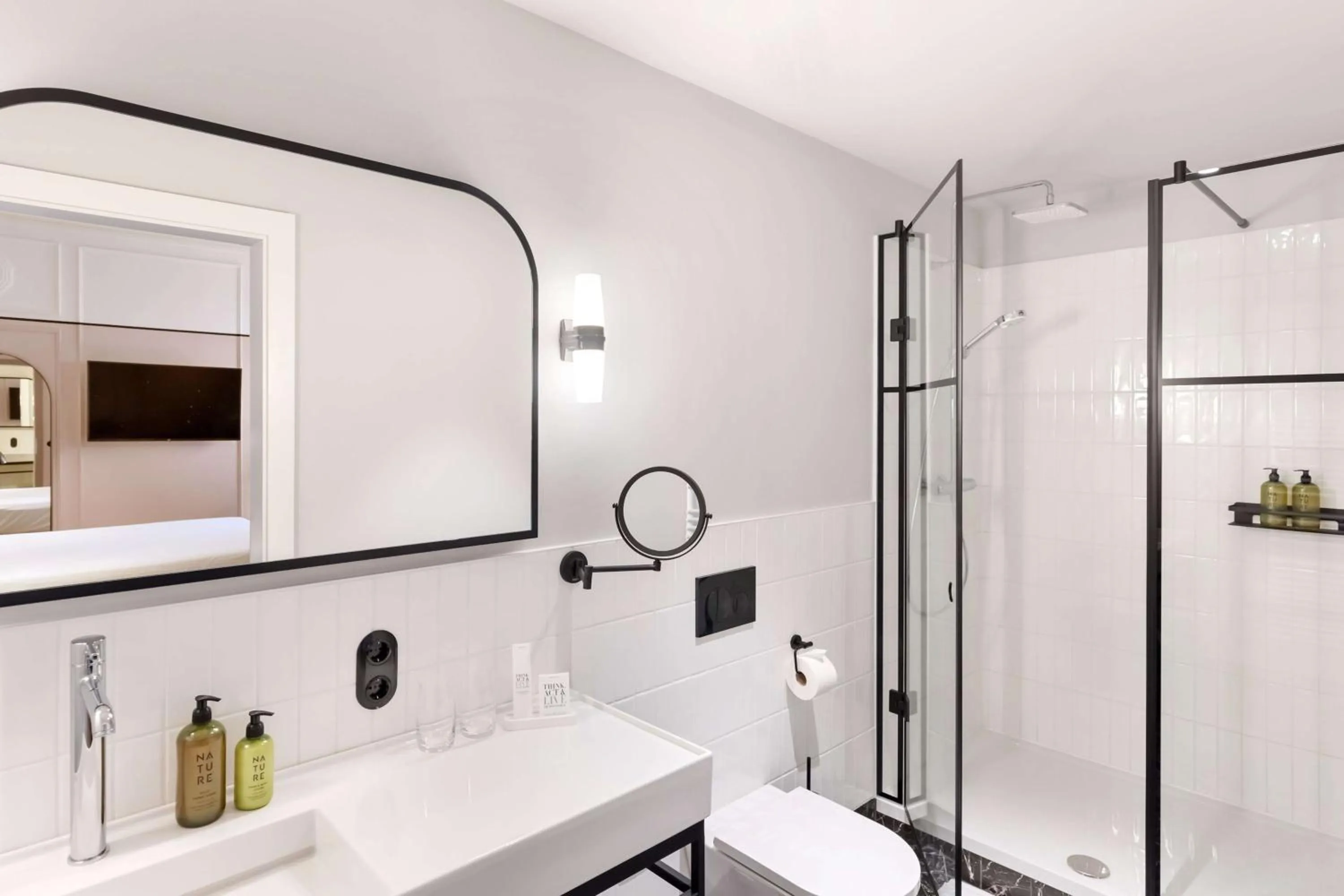 Bathroom in Hotel Astoria Vienna, Curio Collection by Hilton