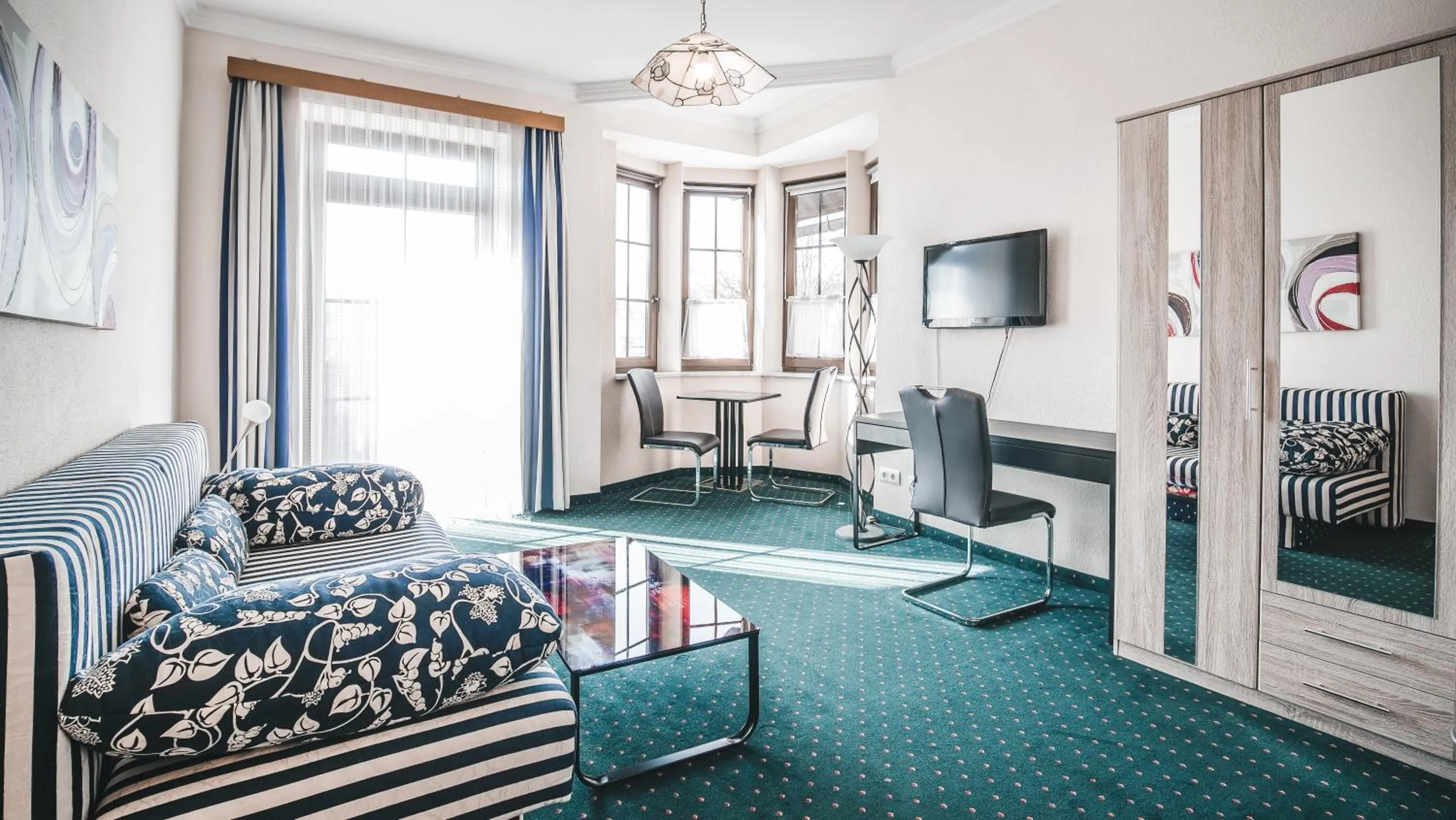 Living room in Hotel Kärntnerhof Velden by S4Y