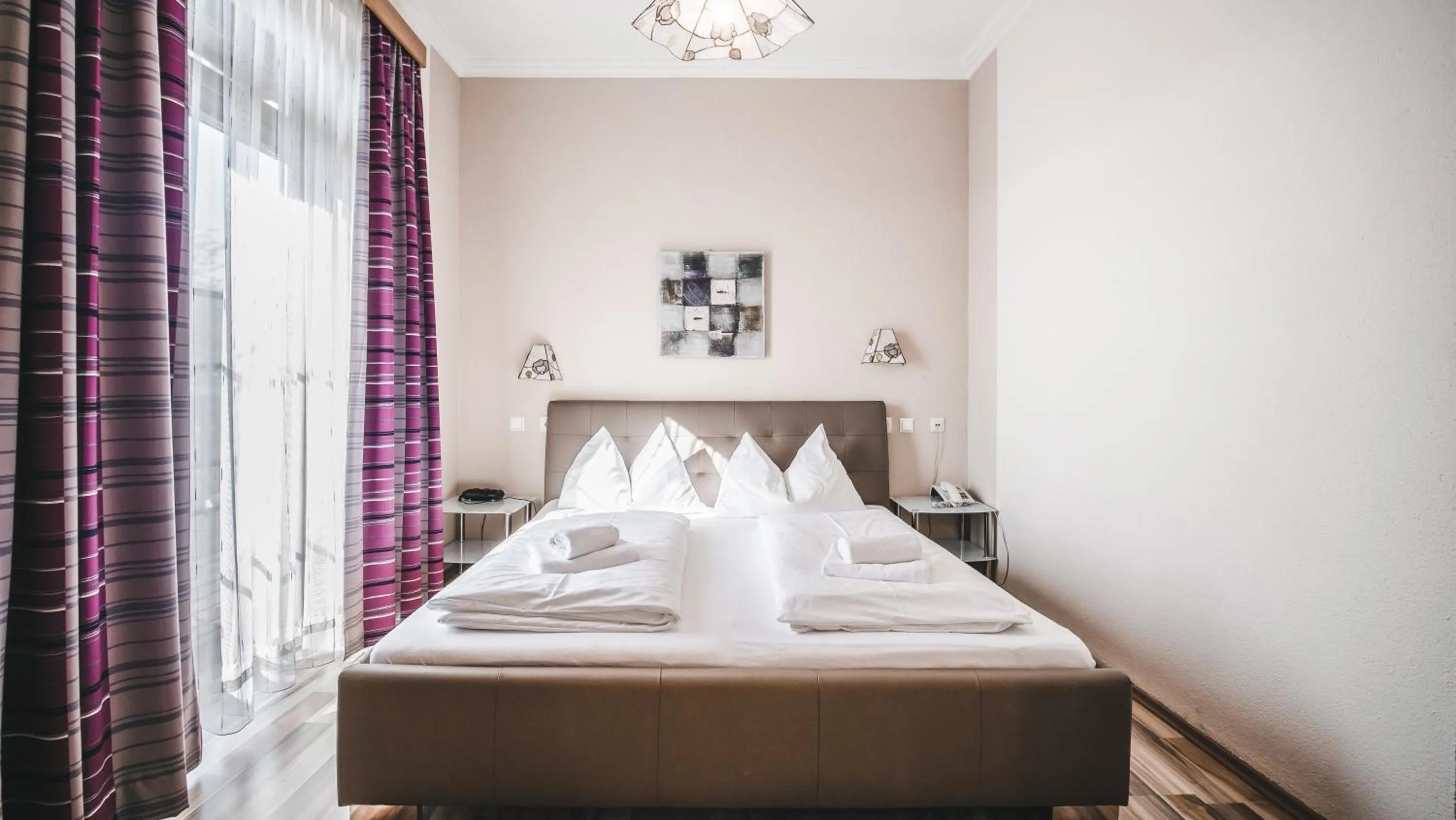 Bedroom, Bed in Hotel Kärntnerhof Velden by S4Y