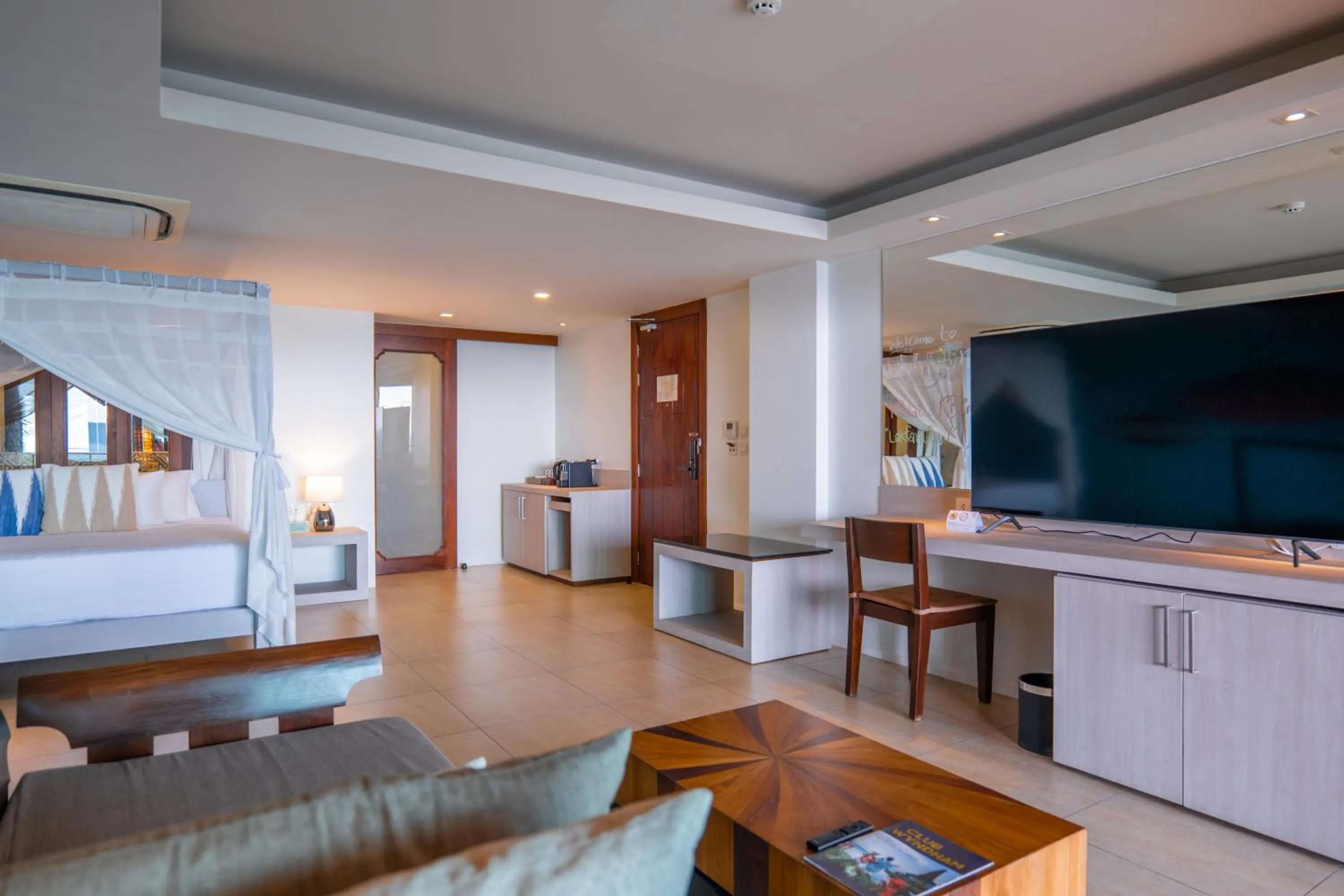 Communal lounge/ TV room in Zenmaya Oceanfront Phuket, Trademark Collection by Wyndham
