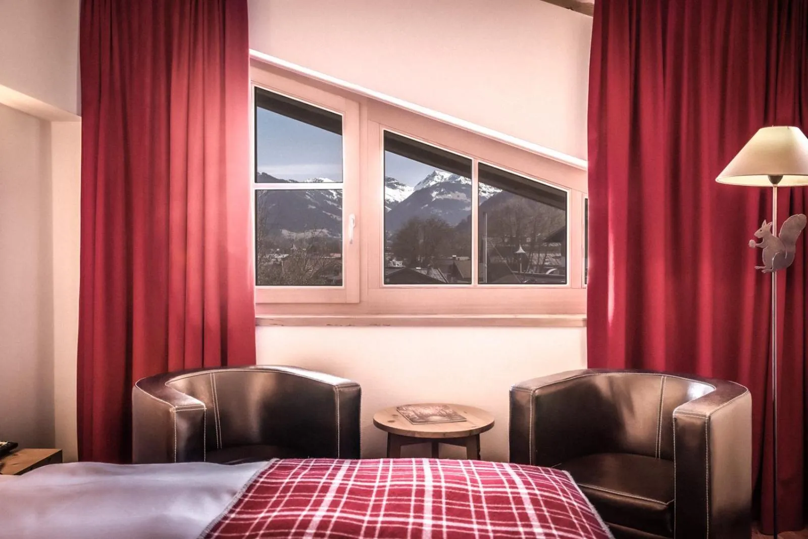 Living room, Bed in Kitzhof Mountain Design Resort, 4 Sterne Superior