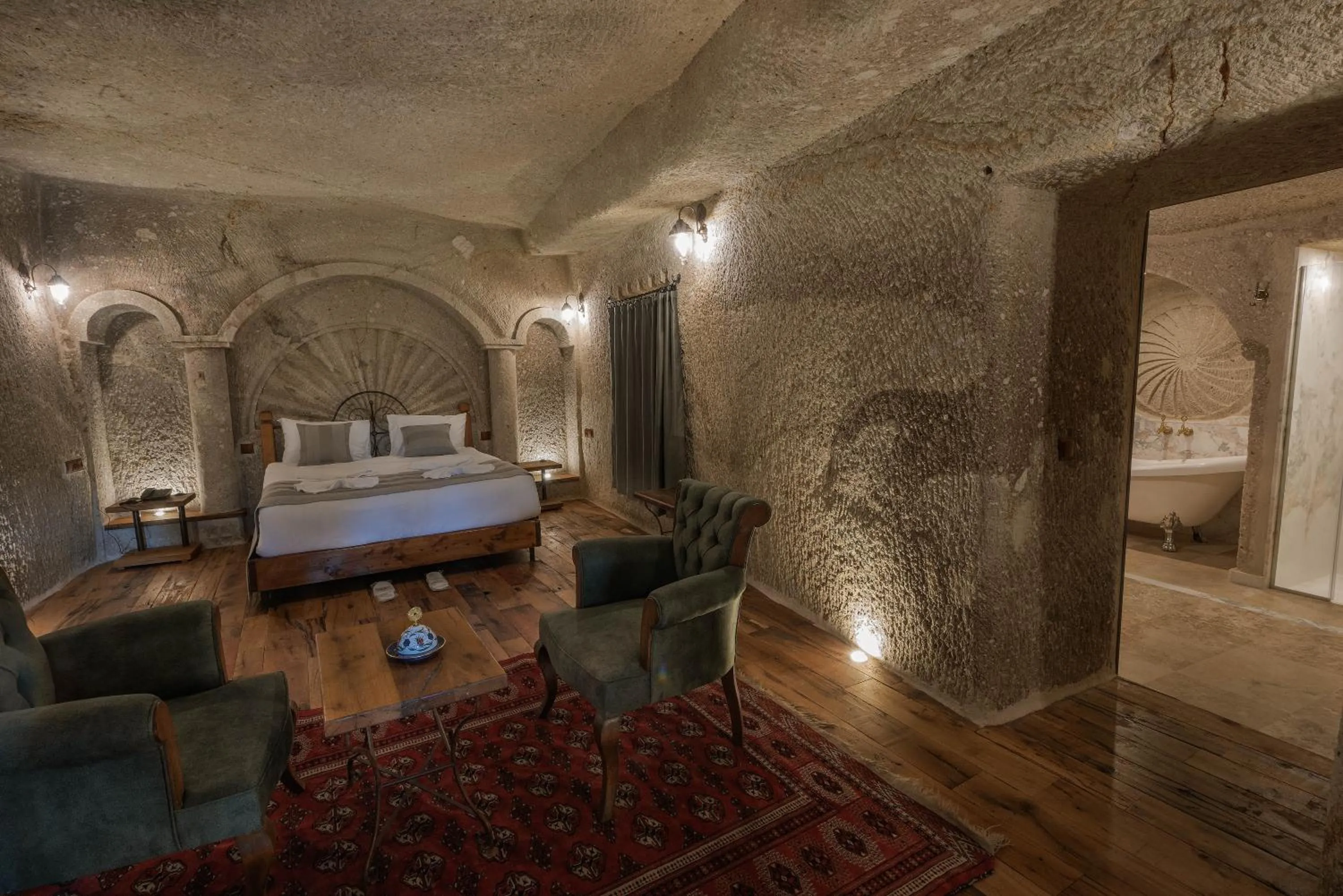 Seating area, Bed in Sarnich Cave Suites