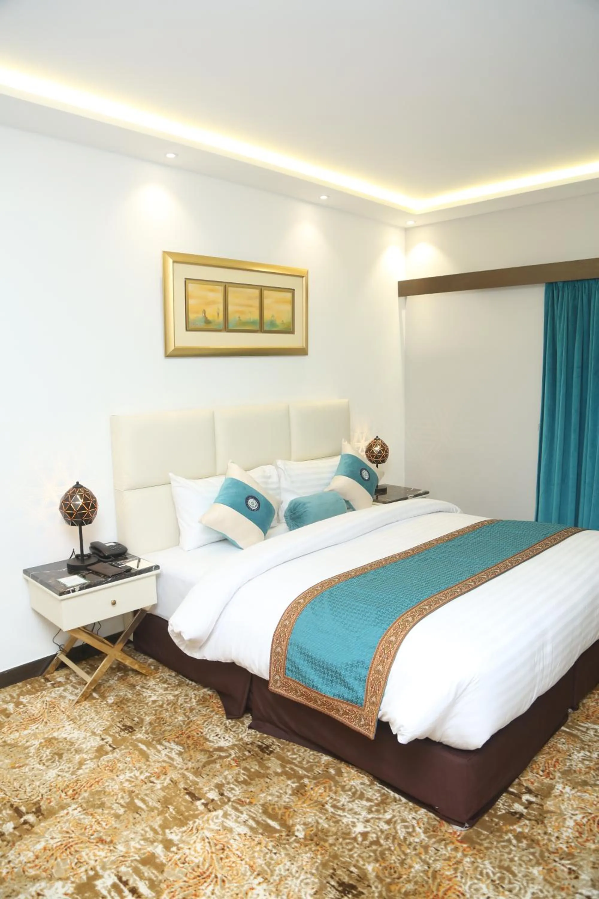 Bed in Faletti's Grand Hotel Multan