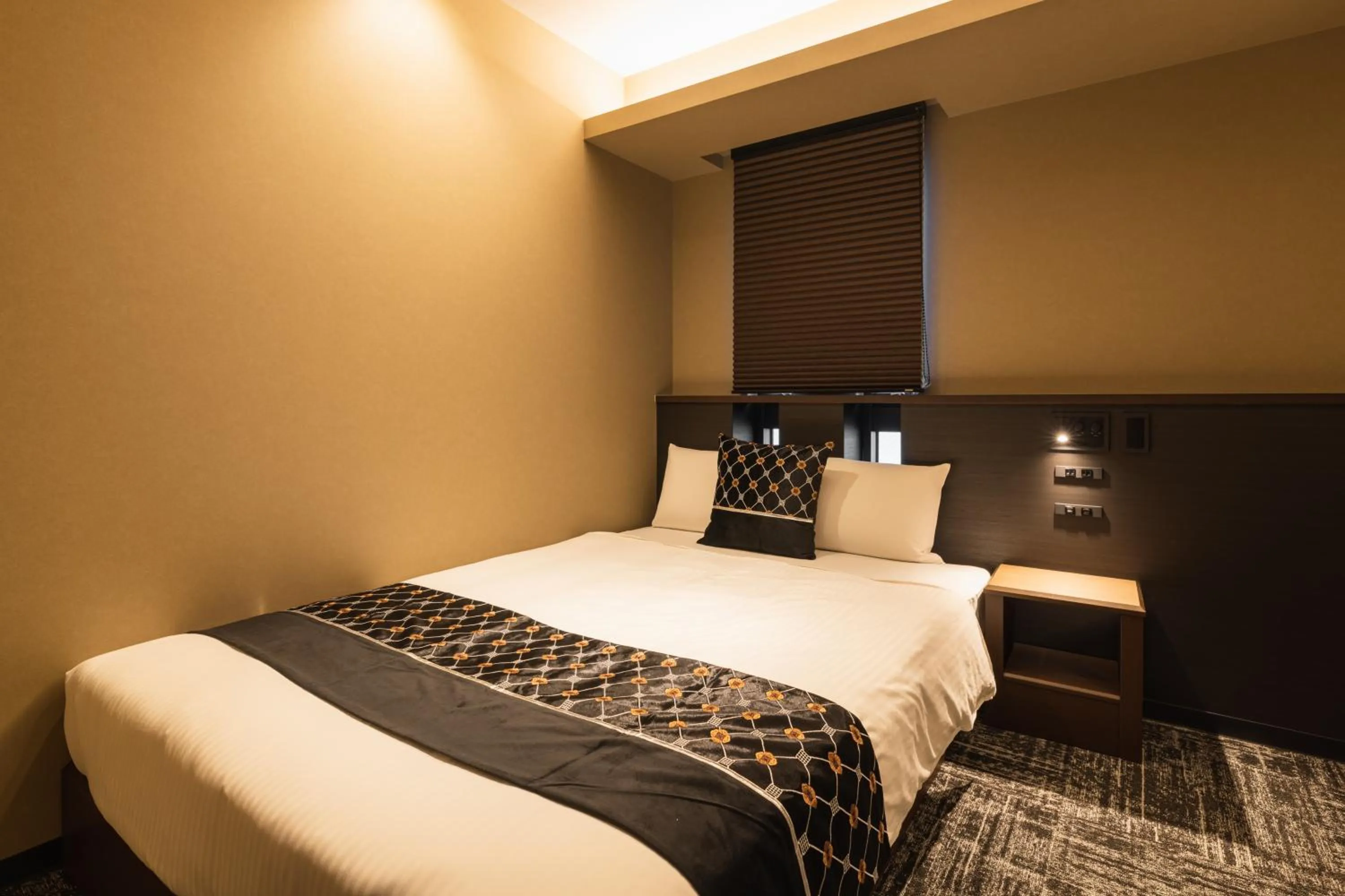 Bed in GRAND BASE Kagoshima Chuo