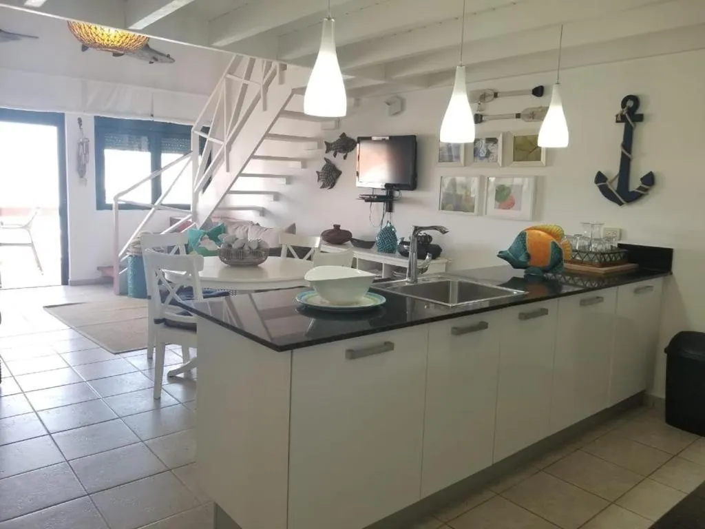 Kitchen or kitchenette in Stanza Mare Beach Front