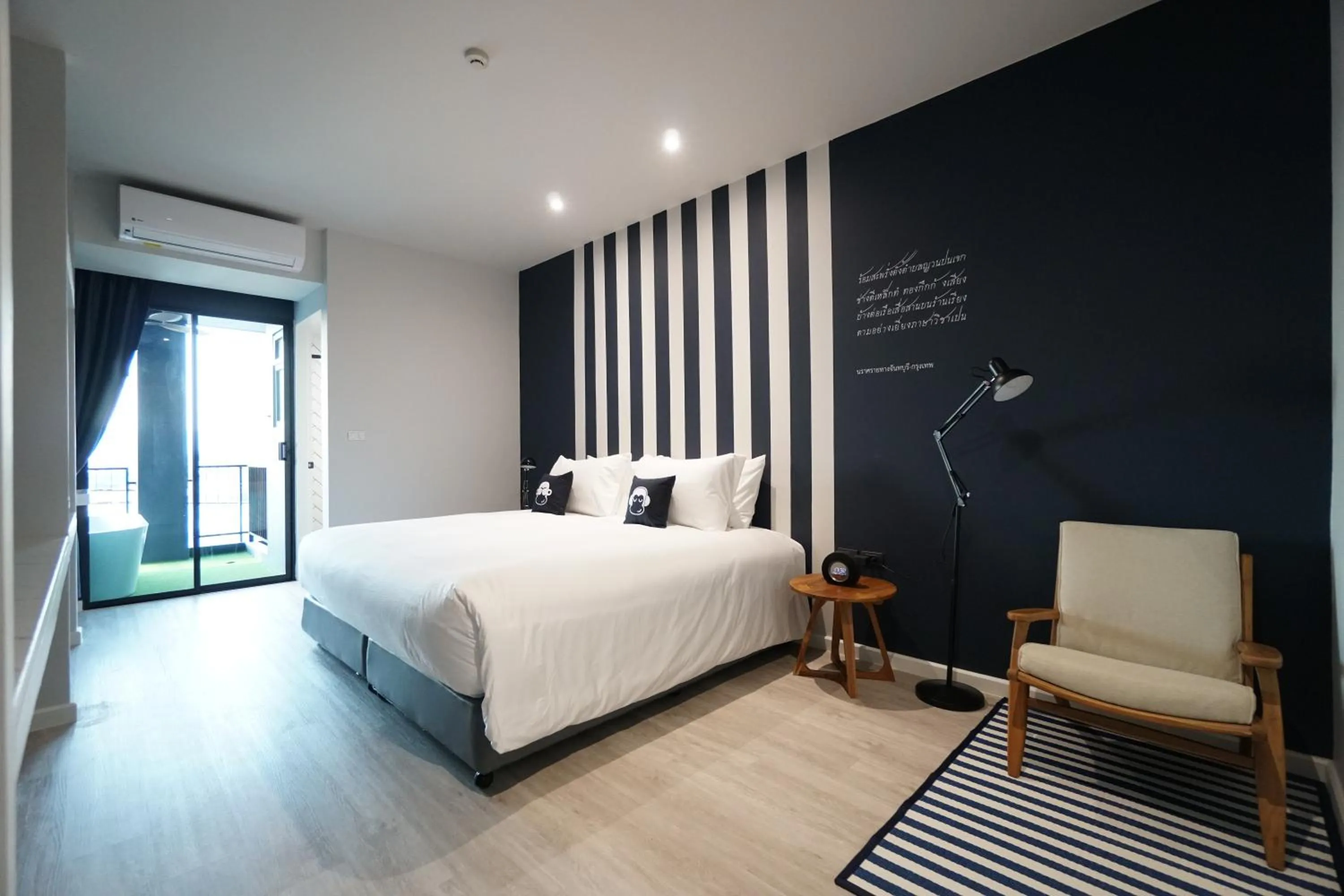 Photo of the whole room, Bed in Blu Monkey Hub and Hotel Chanthaburi