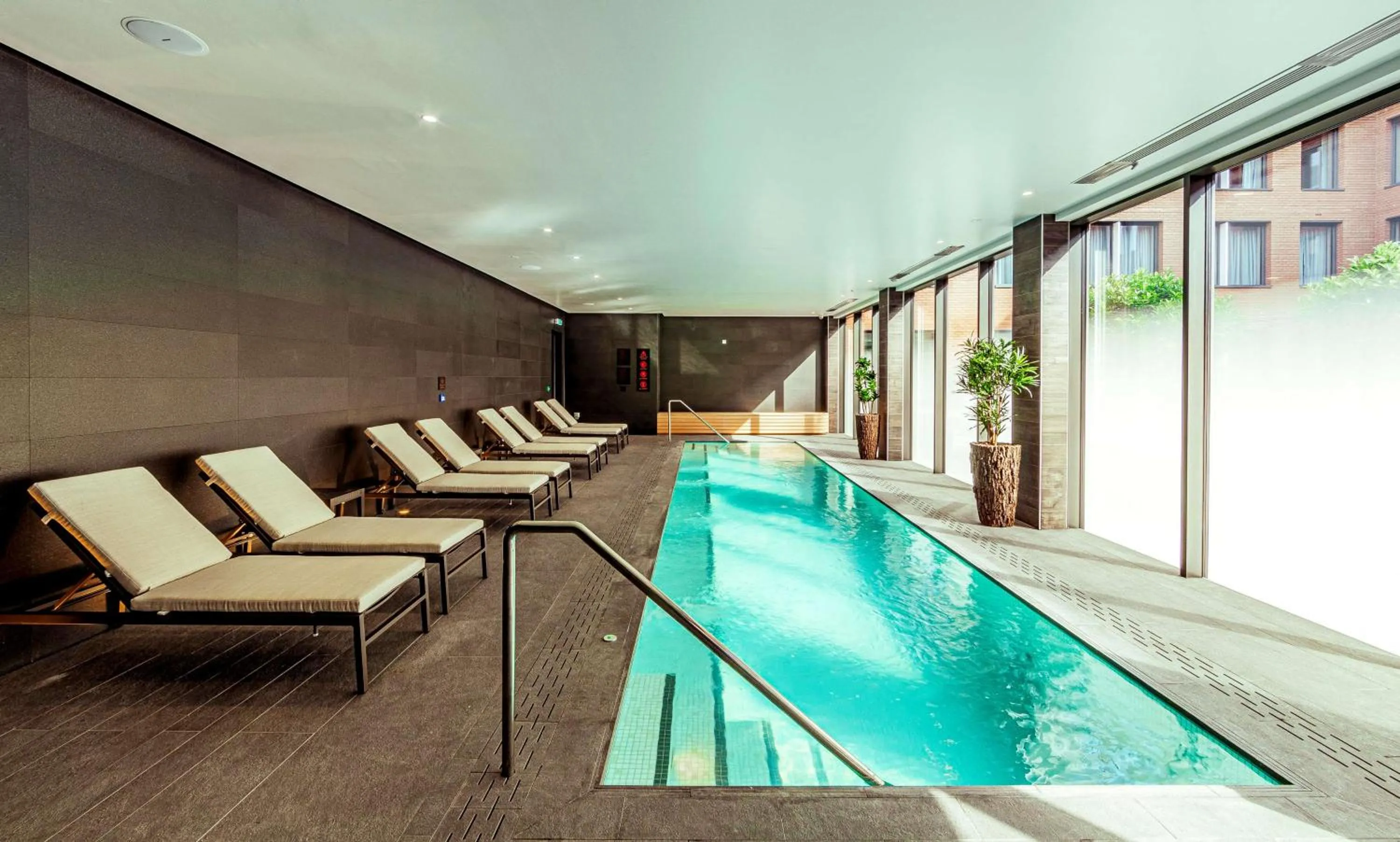 Swimming pool in The Fellows House Cambridge, Curio Collection By Hilton