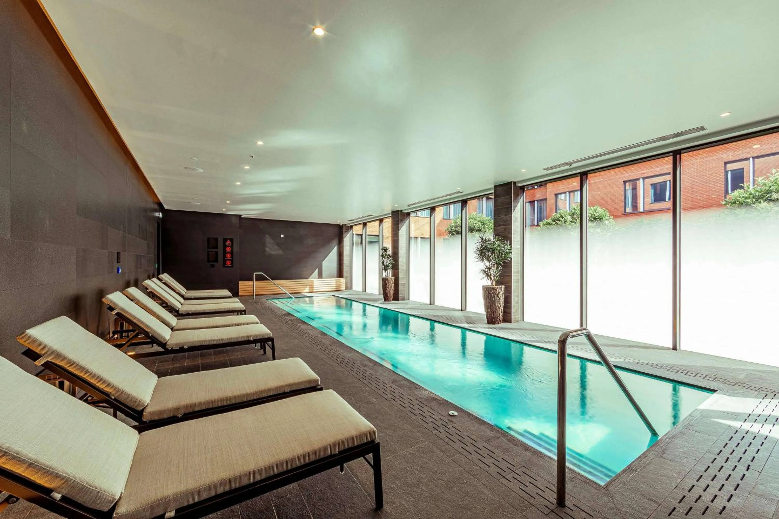 Swimming pool in The Fellows House Cambridge, Curio Collection By Hilton