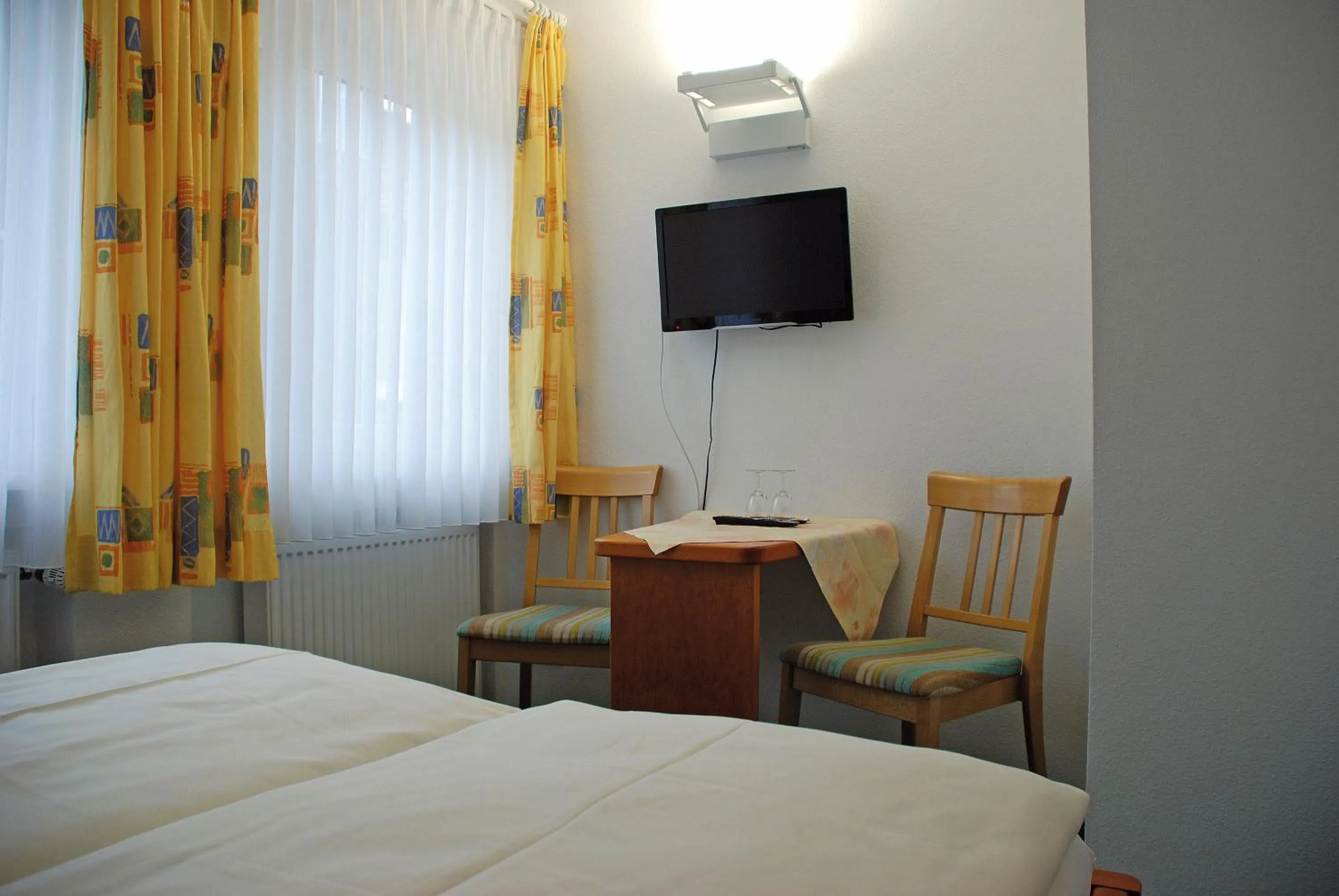 Photo of the whole room, Bed in Seehotel ZUR MÜNZ