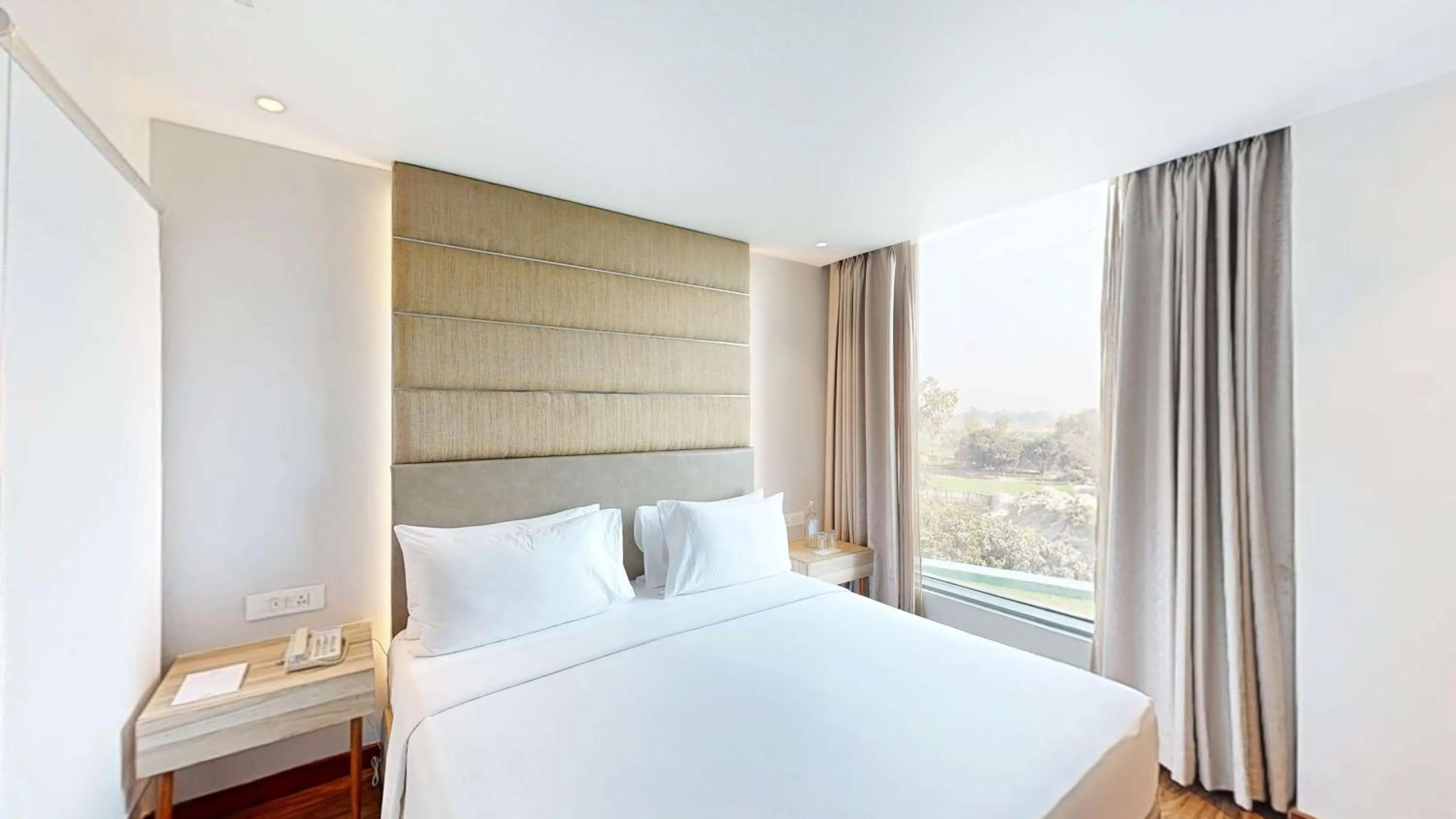 Photo of the whole room, Bed in Radisson Hotel Bareilly Airport