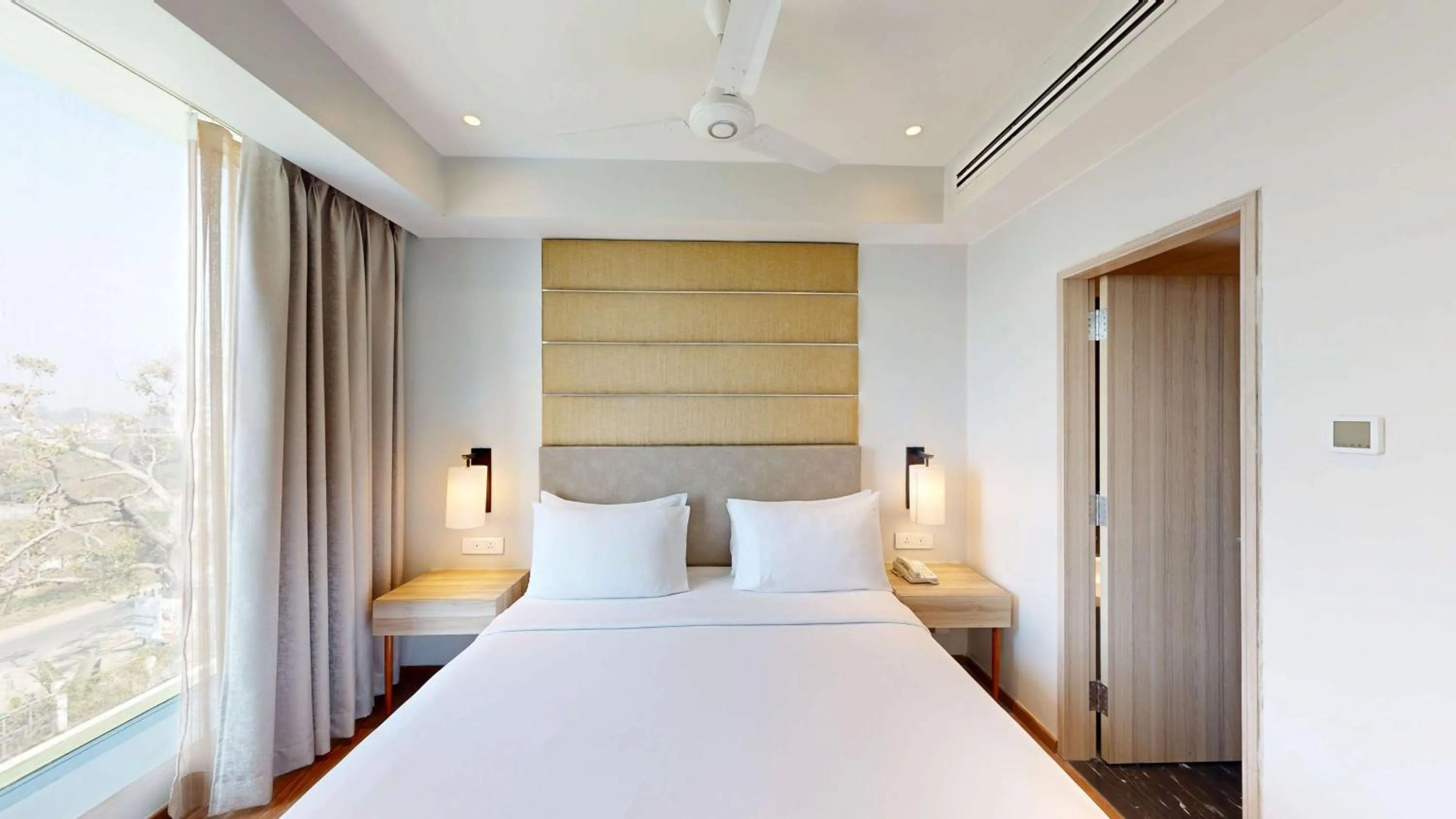 Photo of the whole room, Bed in Radisson Hotel Bareilly Airport