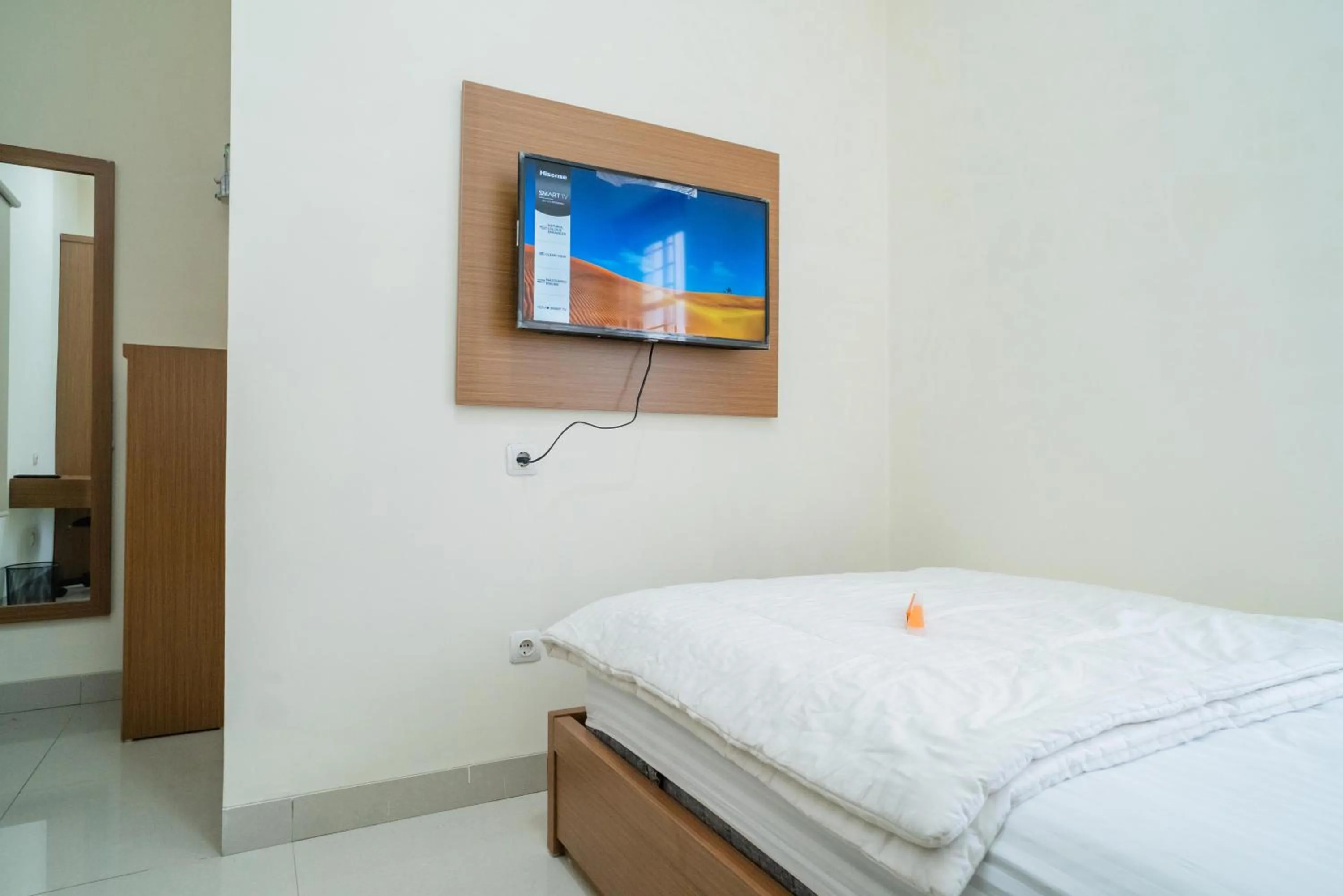 Communal lounge/ TV room, Bed in KoolKost Syariah near Jl Pajajaran Bogor
