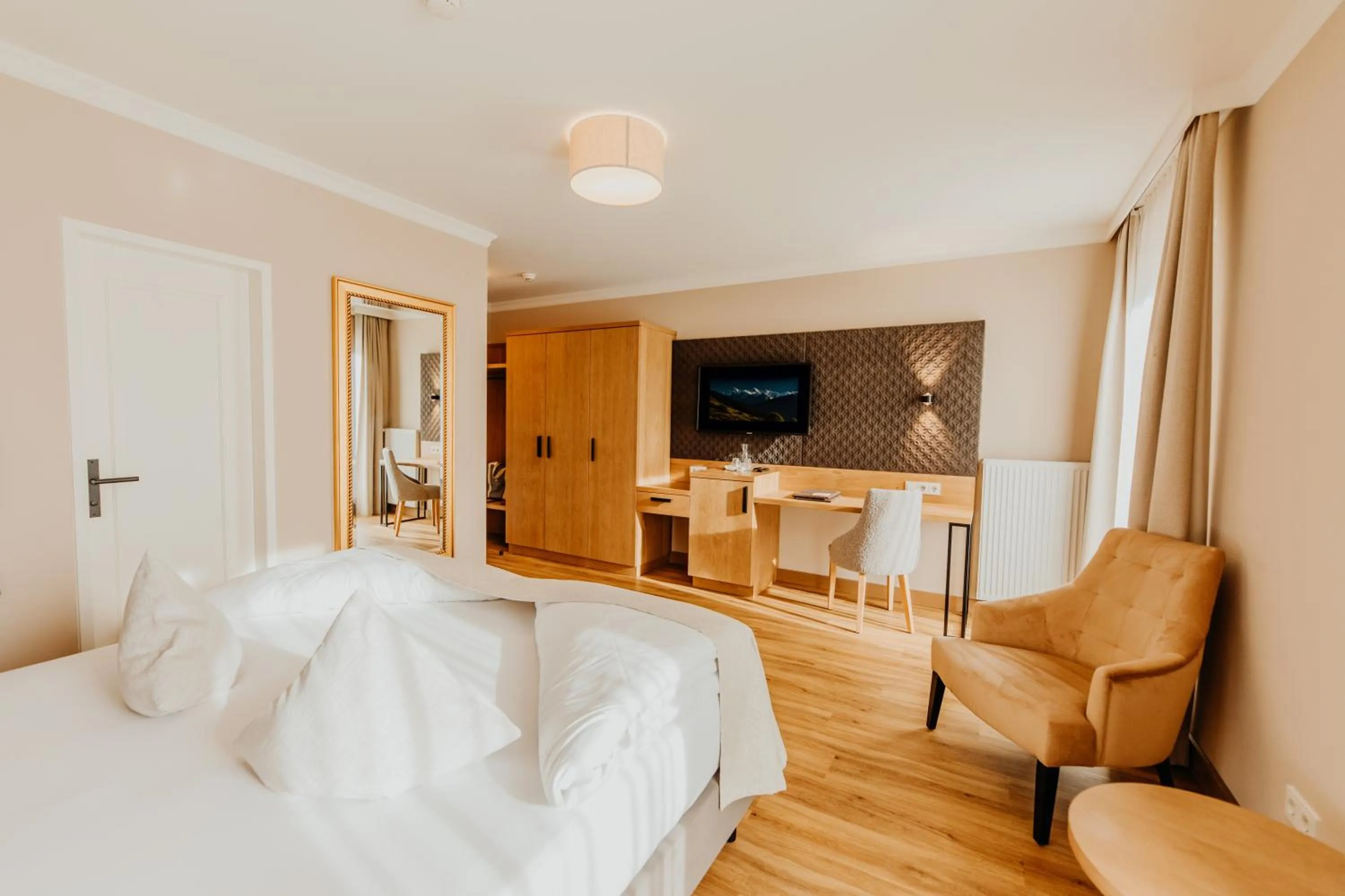 Photo of the whole room, Bed in Post Seefeld - Wellnesshotel Tirol