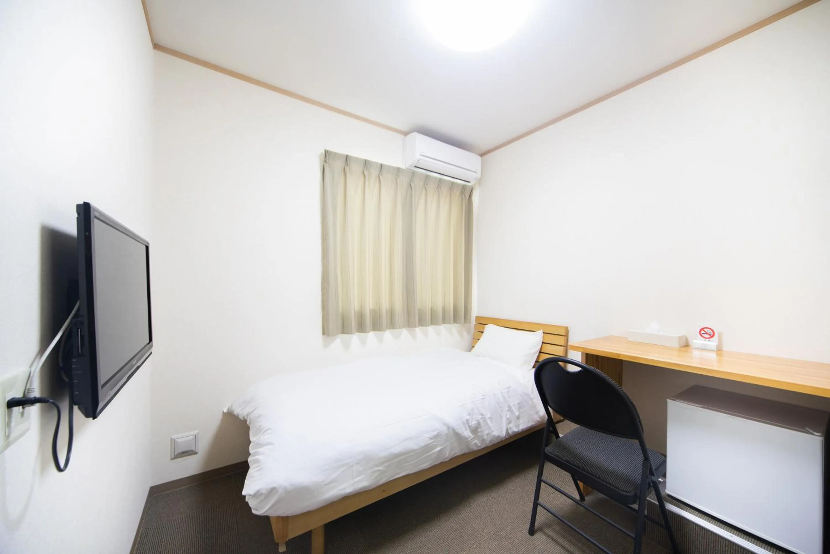 Bed in Tabist Hotel Daimu Minami-Souma