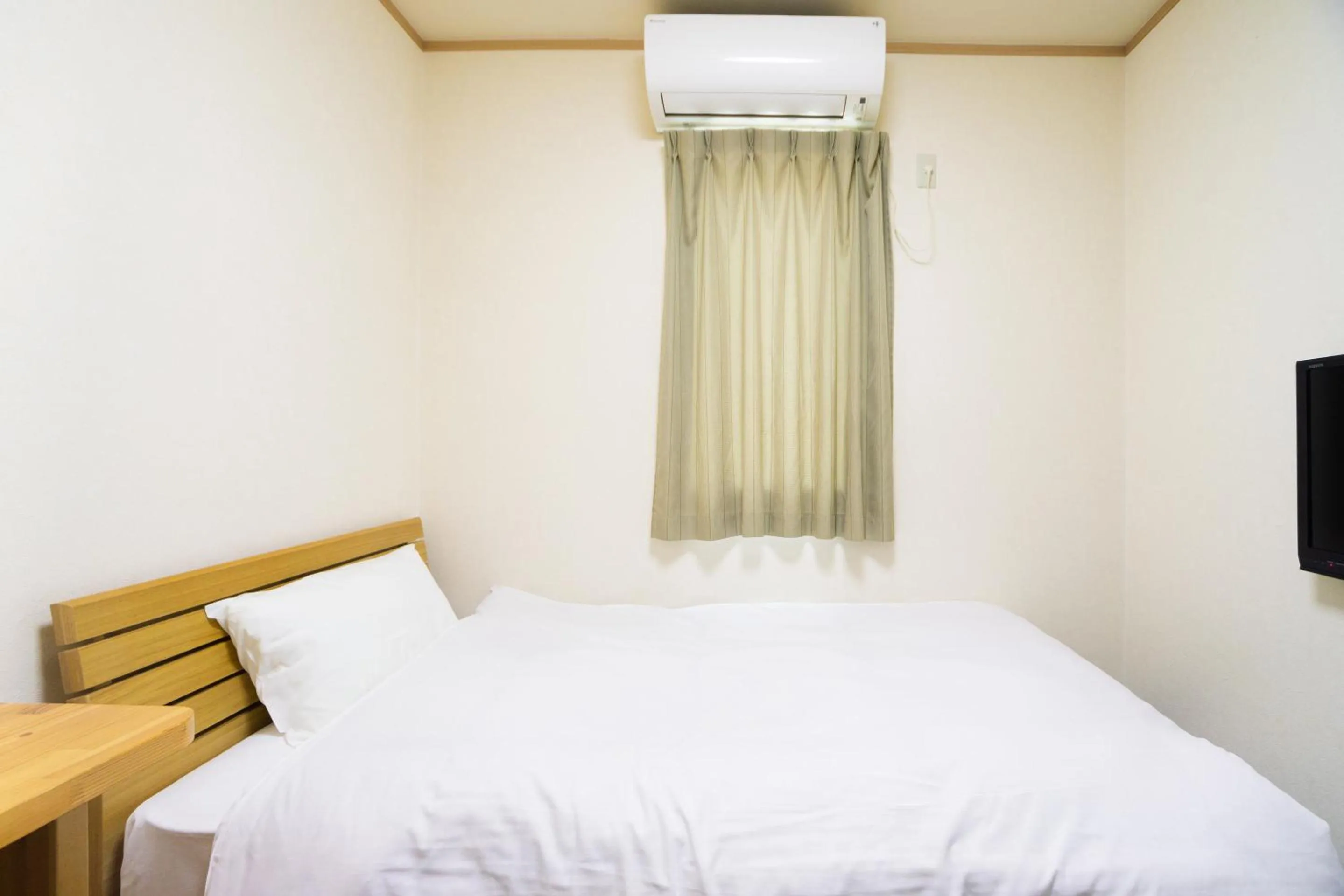 Bed in Tabist Hotel Daimu Minami-Souma