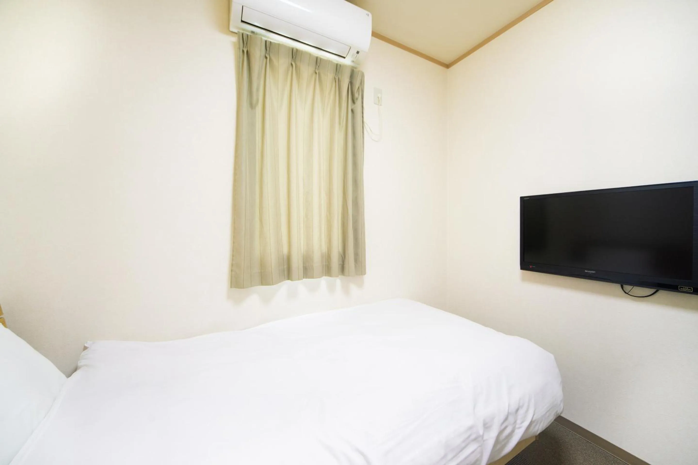 Bed in Tabist Hotel Daimu Minami-Souma