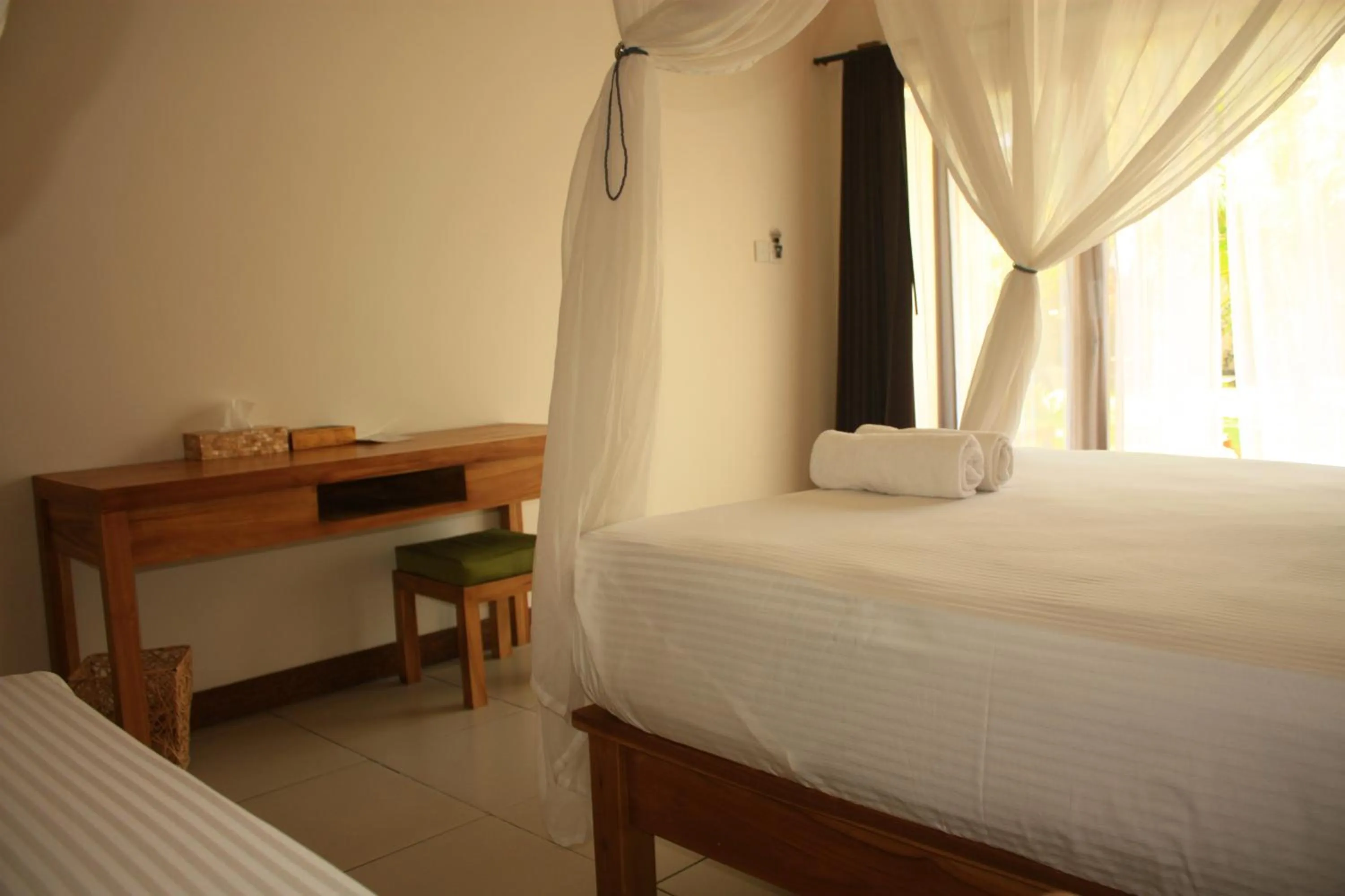 Bed in Arjuna Homestay