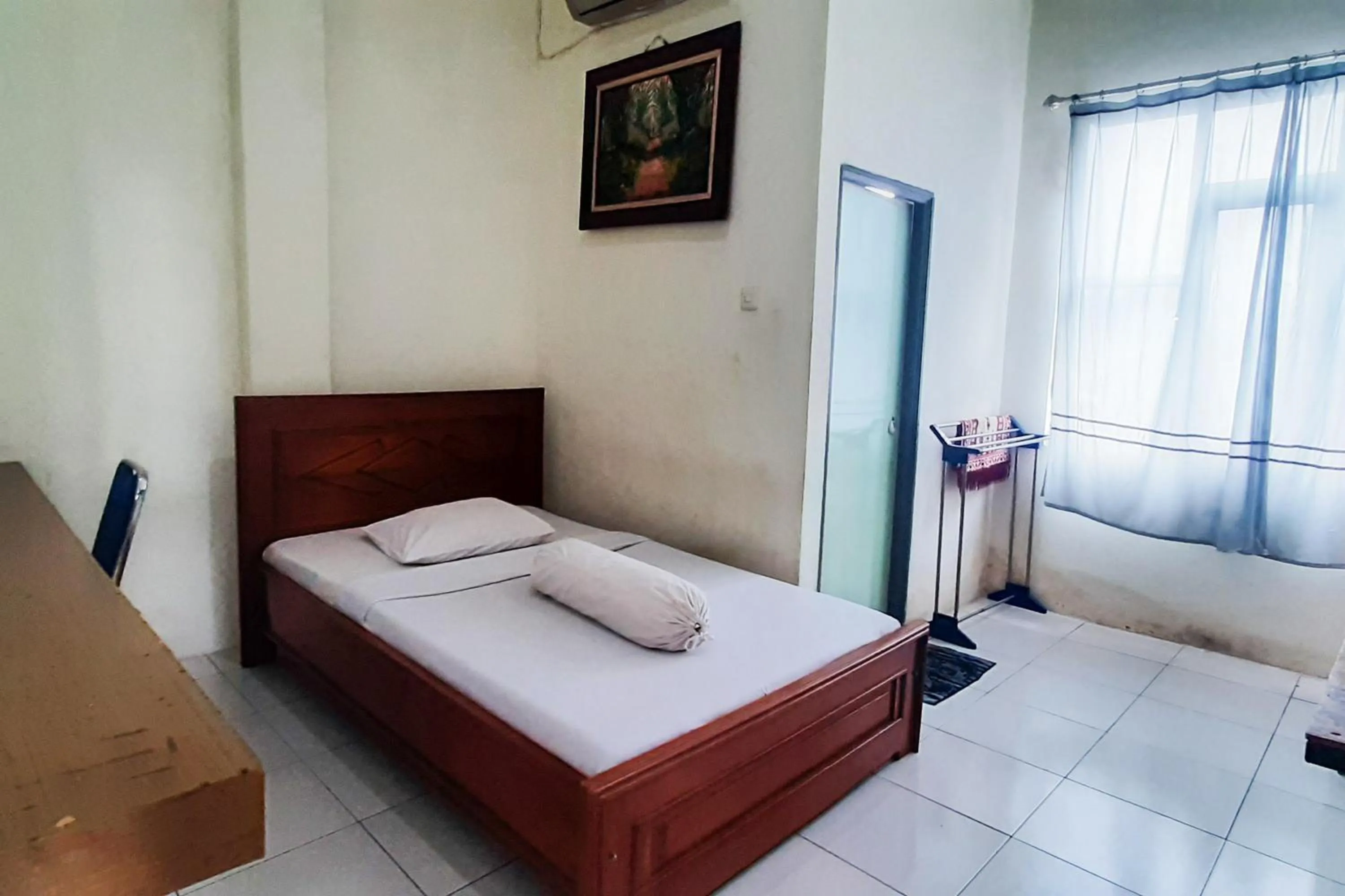 Bed in RedDoorz Syariah At Penginapan Sederhana Palembang