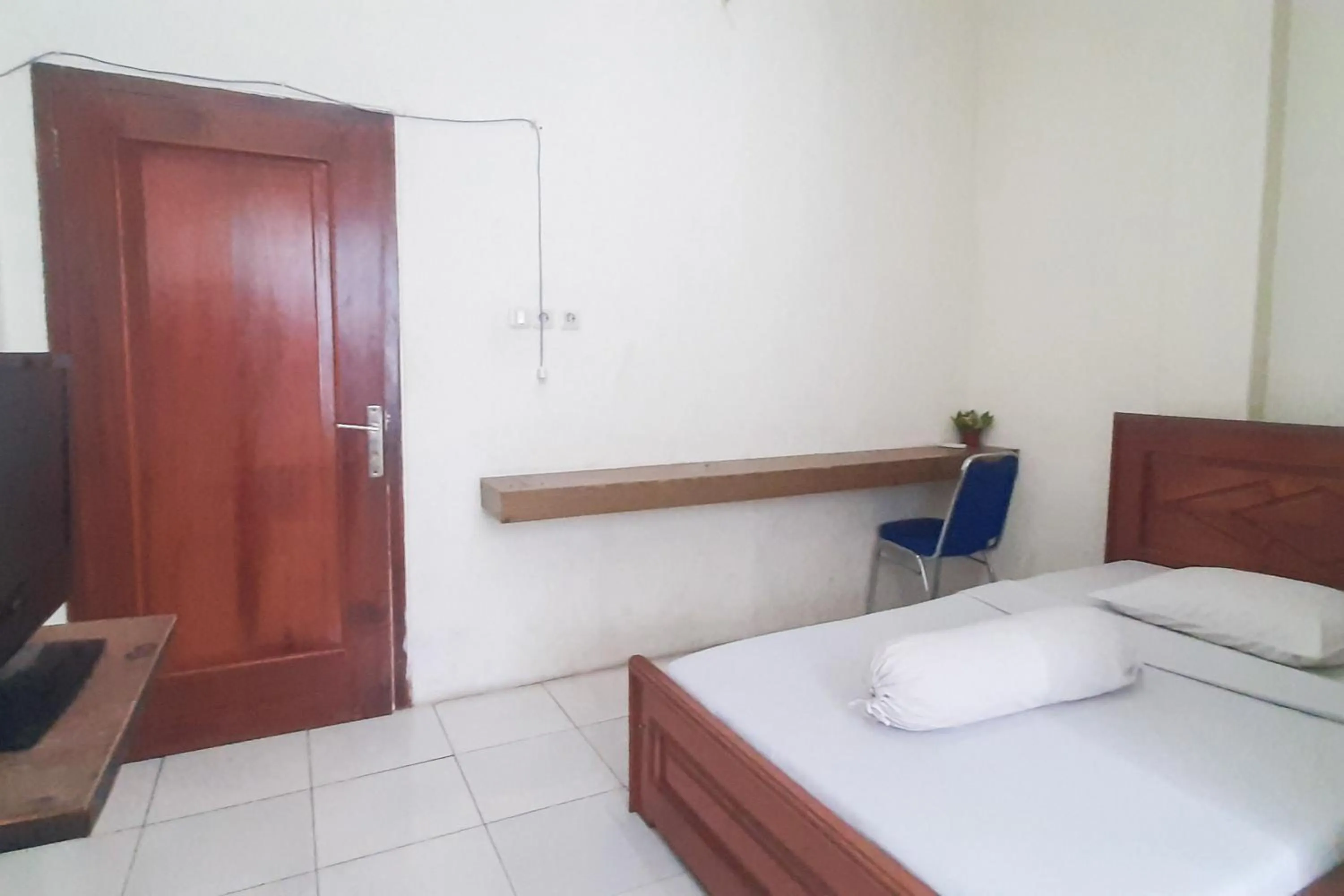 Bed in RedDoorz Syariah At Penginapan Sederhana Palembang