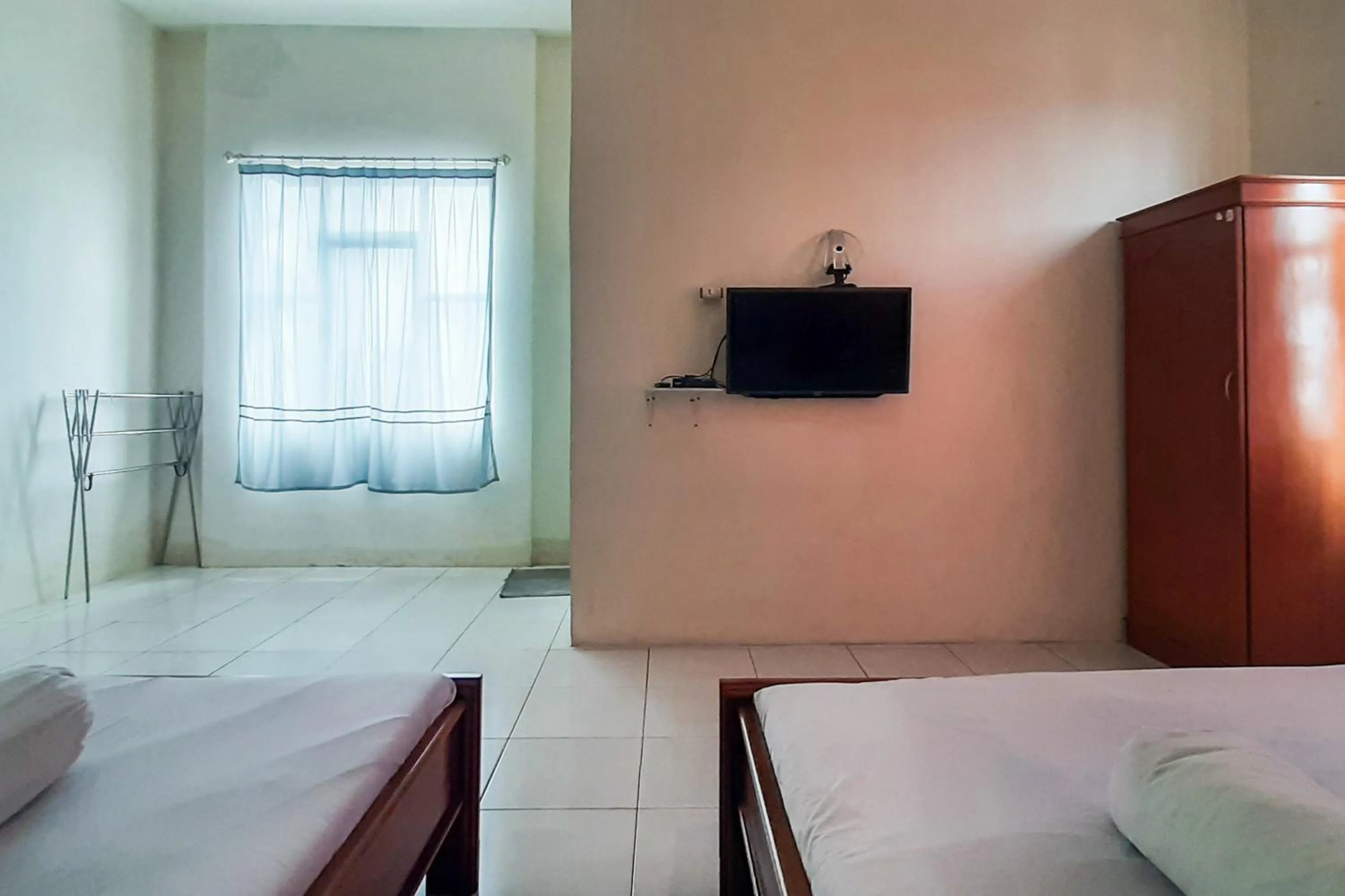 Bed in RedDoorz Syariah At Penginapan Sederhana Palembang