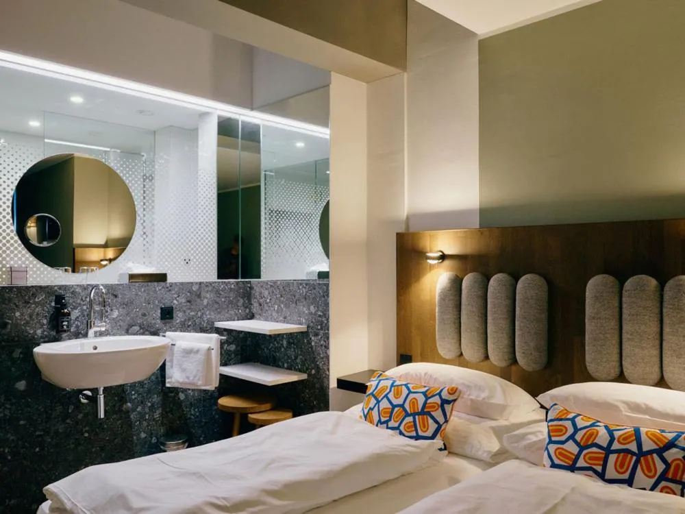 Bathroom, Bed in Hotel Ploberger