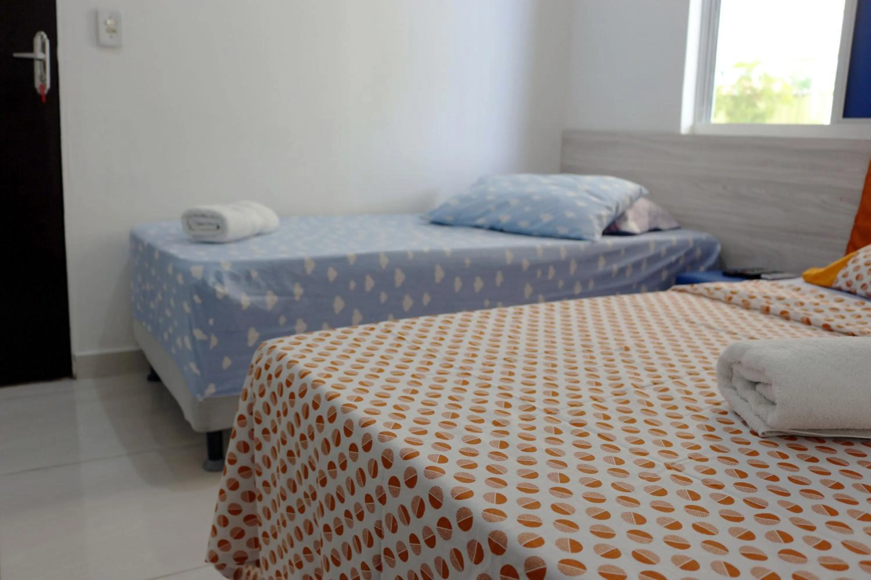 Bed in Pousada Executiva SolRiso Aeroporto Florianópolis