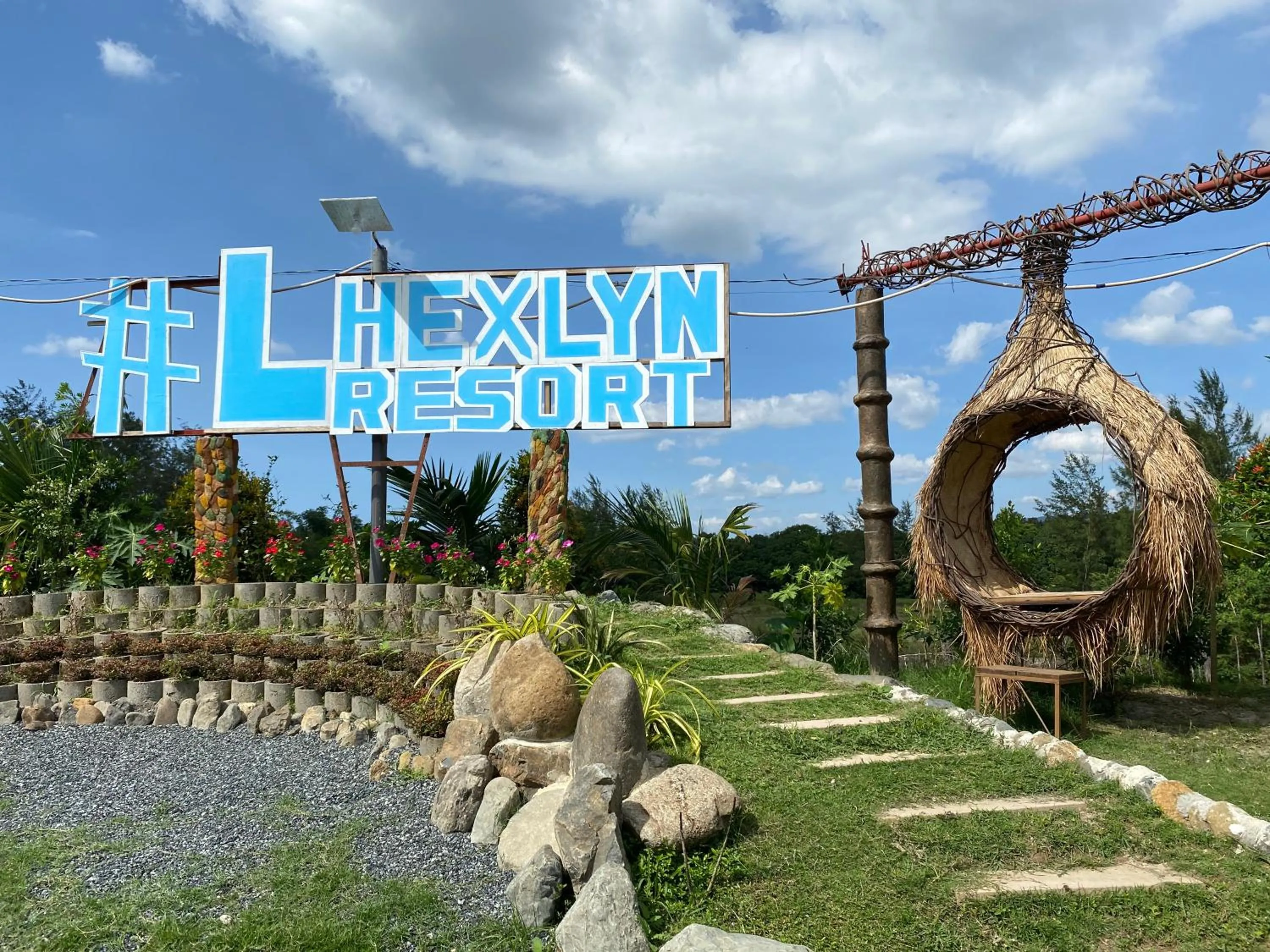 Property logo or sign in RedDoorz Plus @ Lhexlyn Resort San Narciso