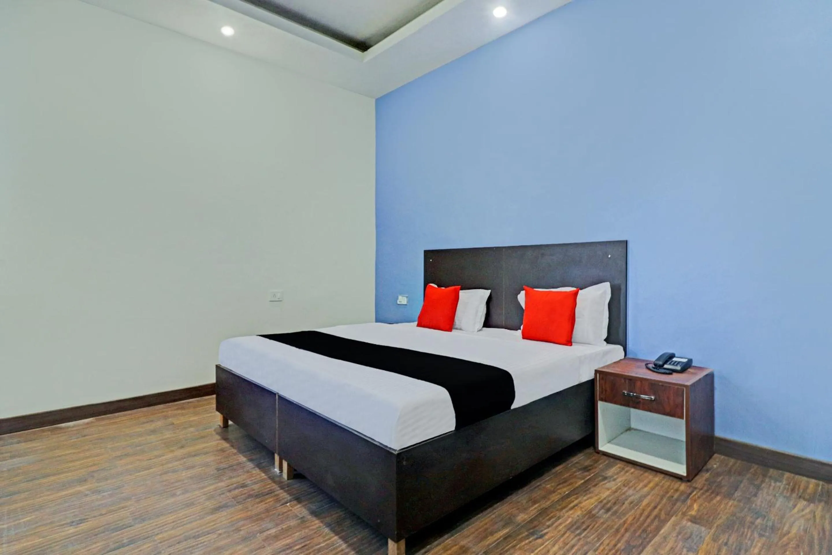 Bedroom in Capital O Kanha Resort