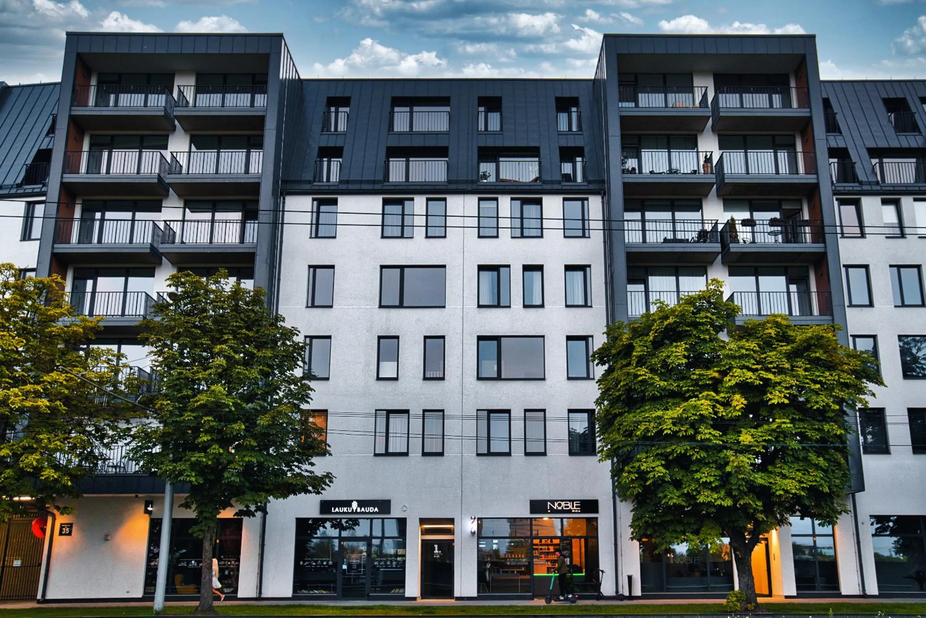 Scan QR code for apartment video tour - free parking, gym access, air conditioning, kitchen and more in central Riga