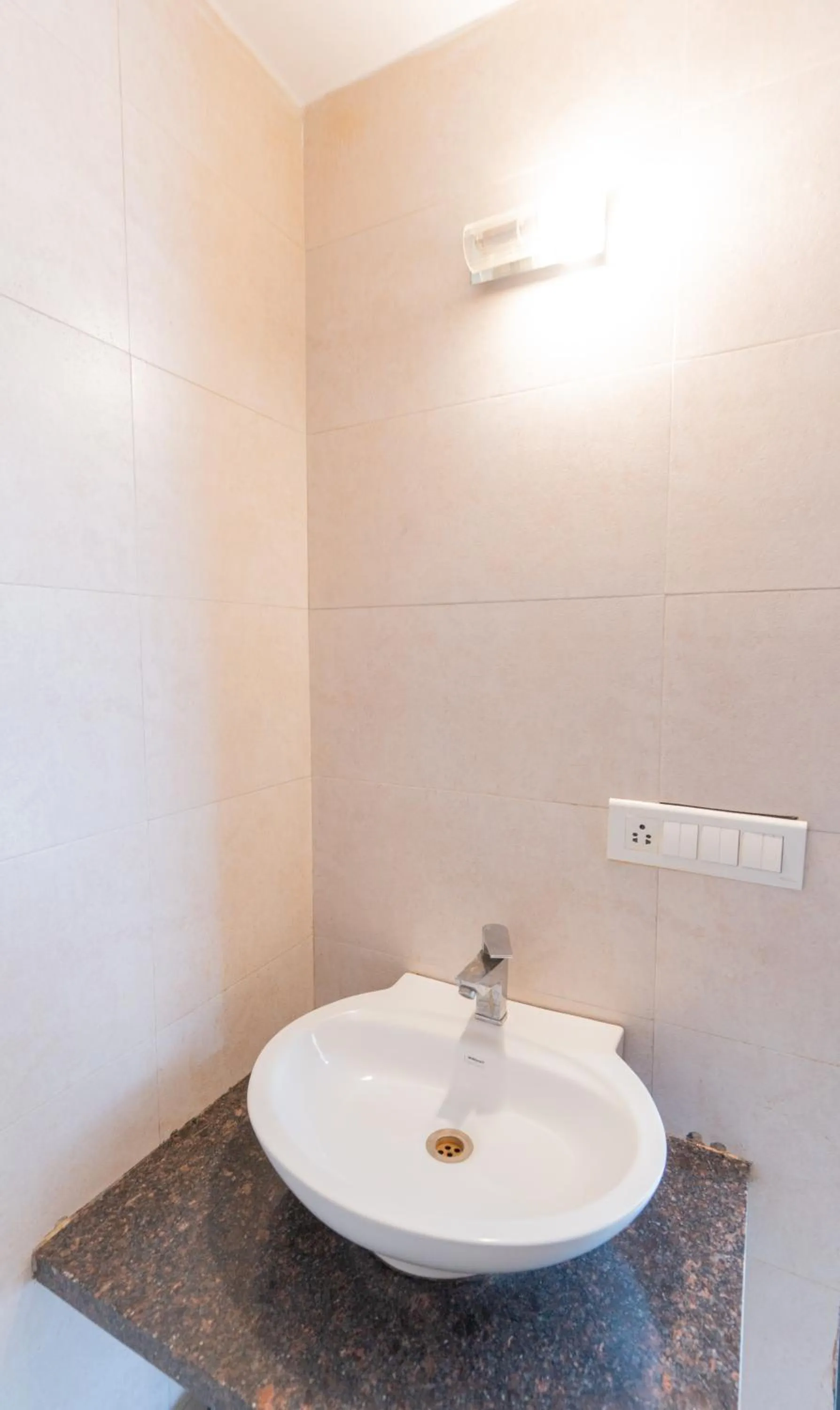 Bathroom in Hotel Krishna by KeyMagics