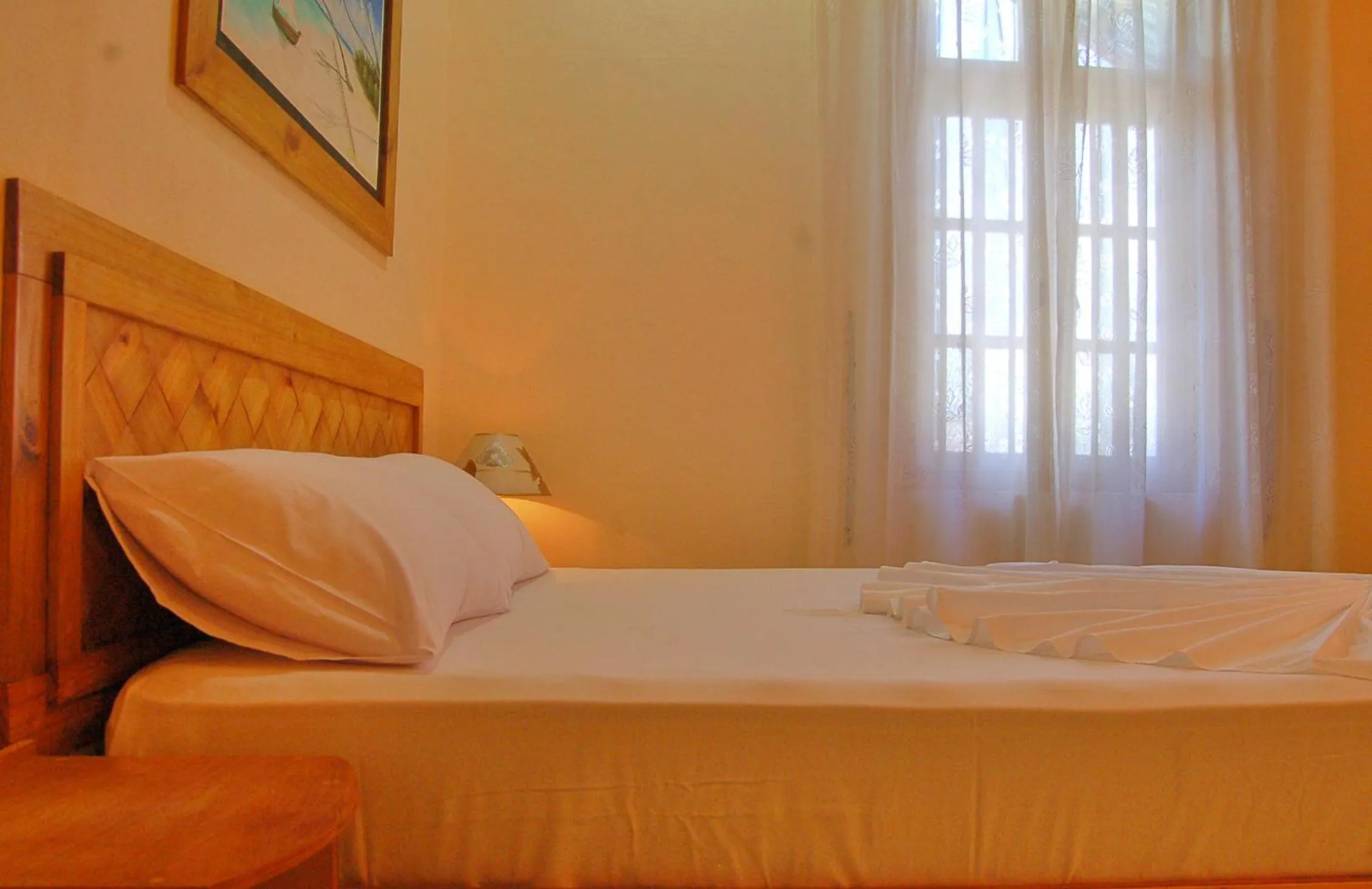 Bed in Vaali Maldives Island Escapes & Dive