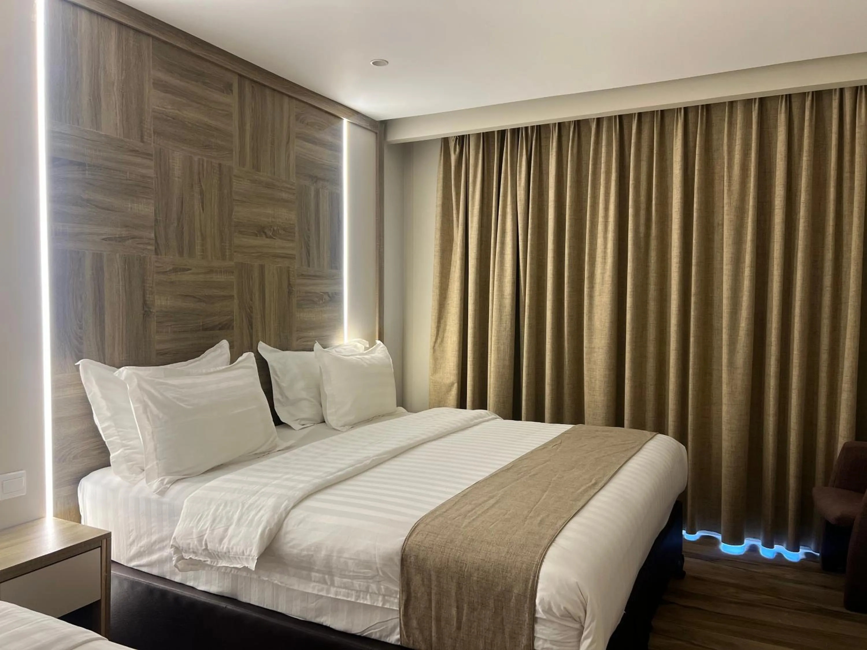 Bed in Mass Paradise Hotel