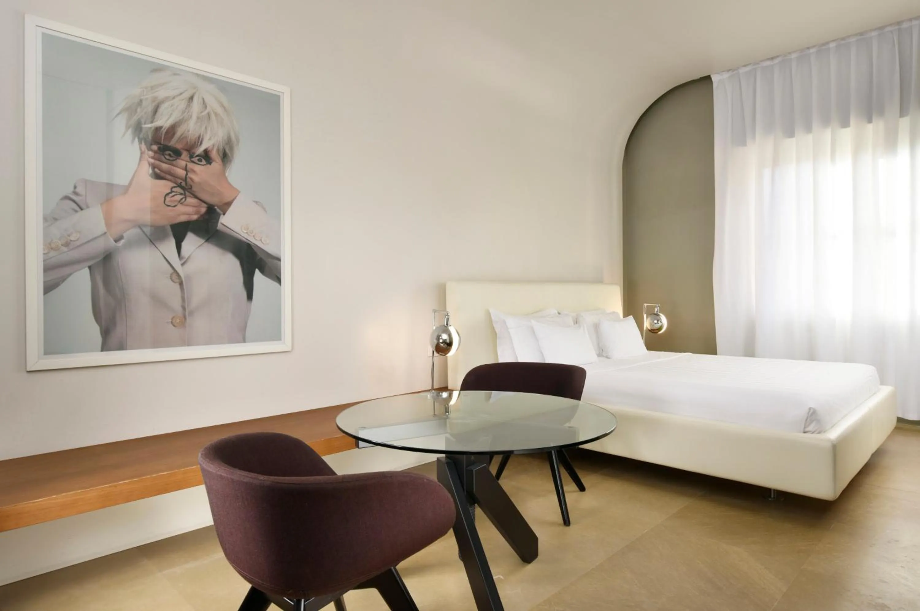 Bed in Palazzo Montemartini Rome, A Radisson Collection Hotel