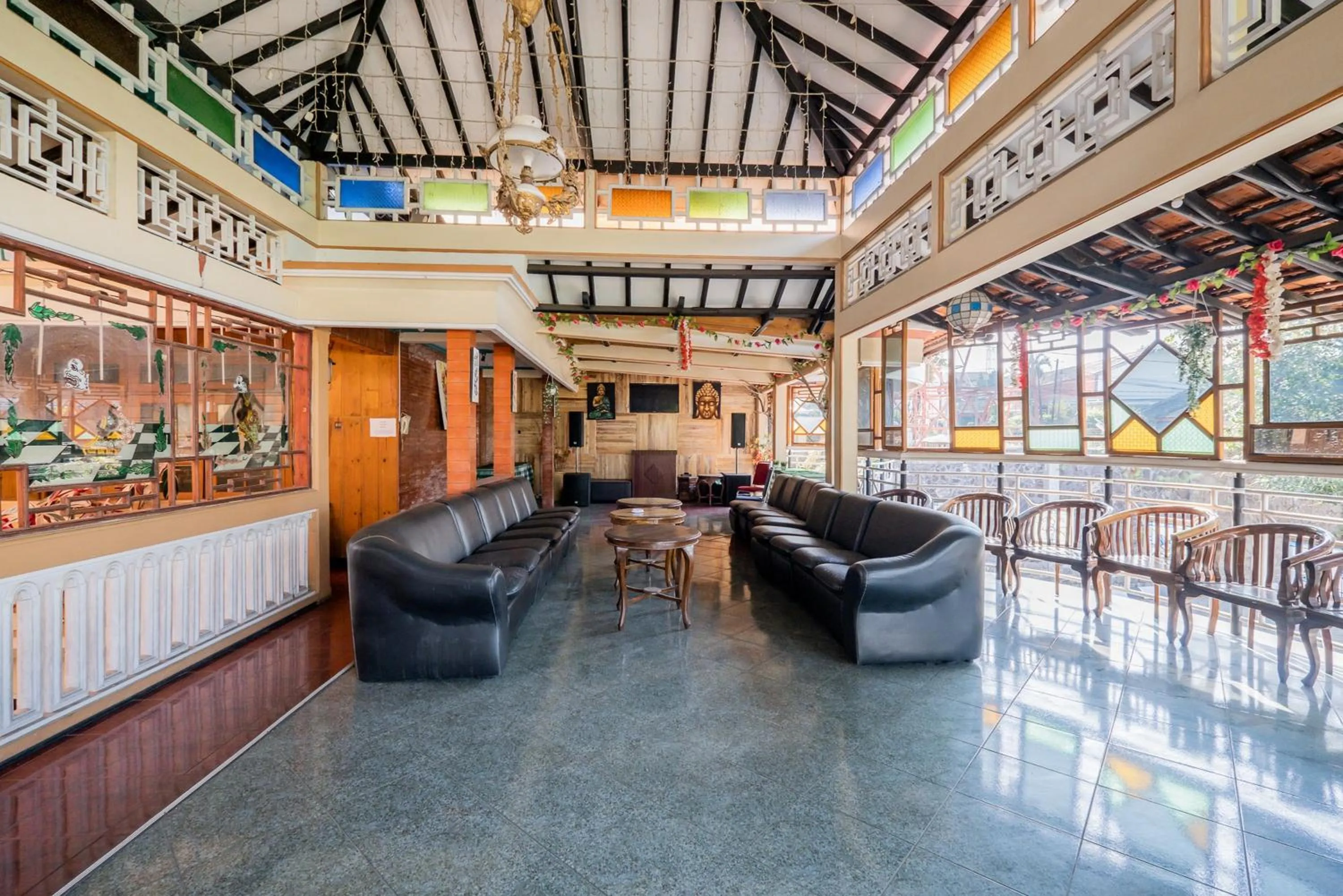 Seating area in Palereman Hotel RedPartner near Jatim Park 1