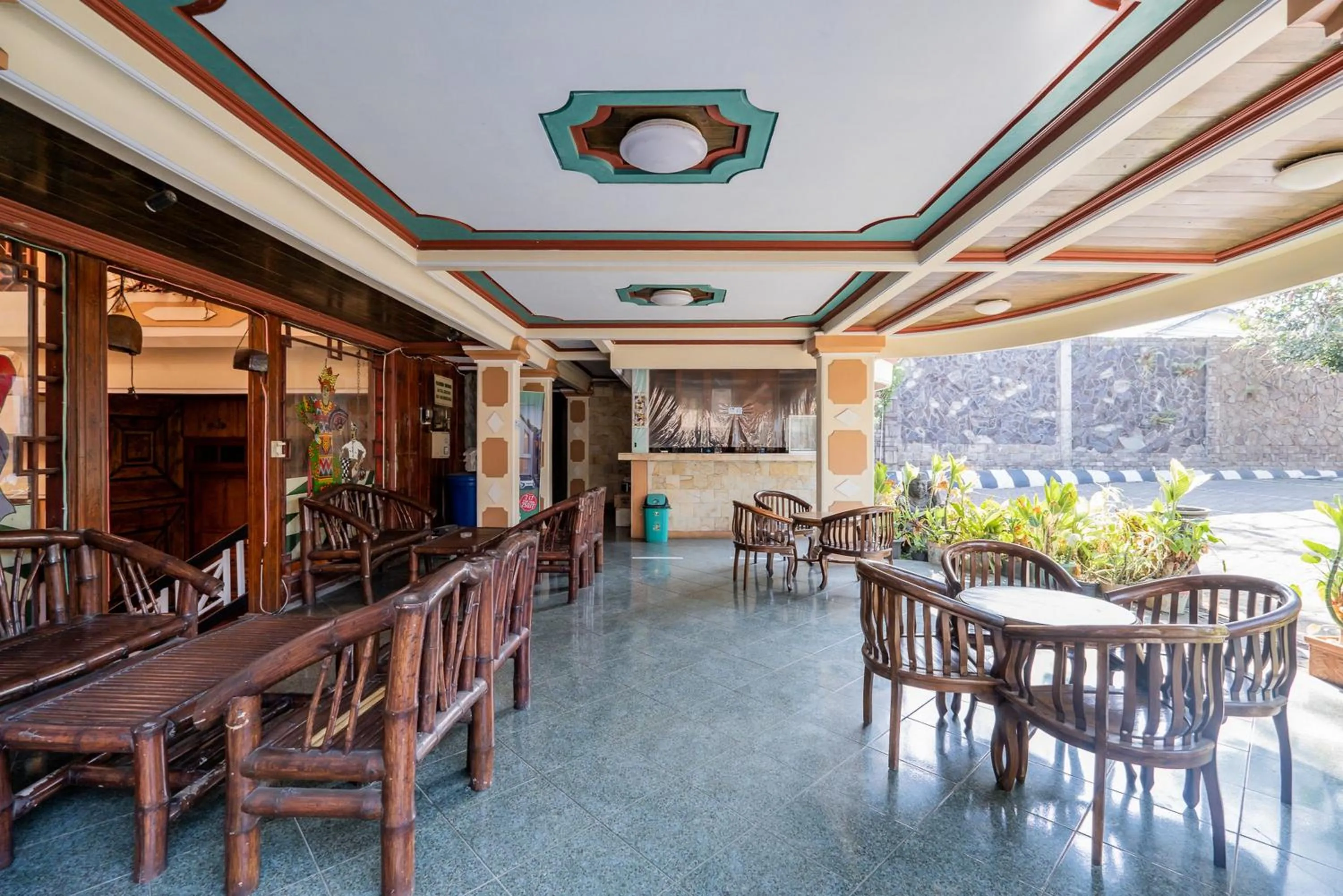 Seating area in Palereman Hotel RedPartner near Jatim Park 1