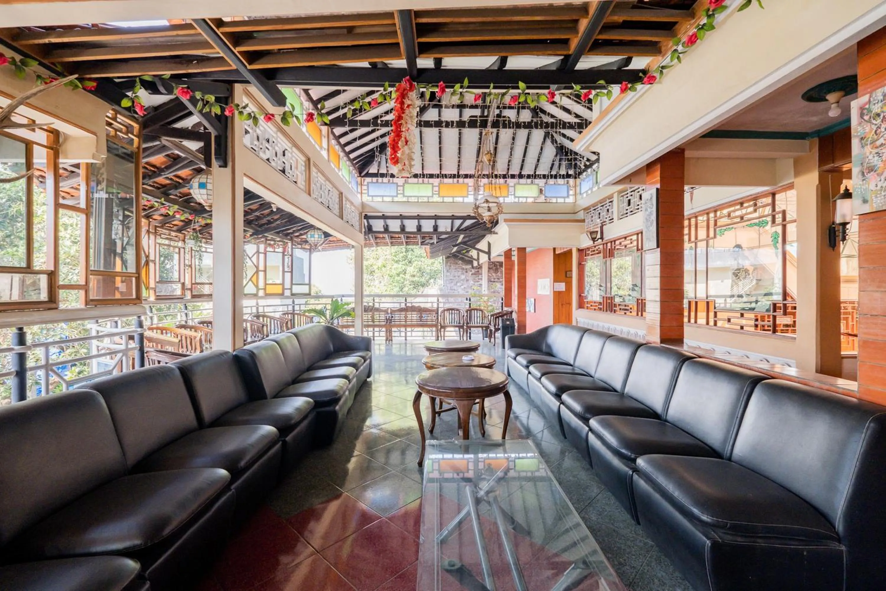 Seating area in Palereman Hotel RedPartner near Jatim Park 1