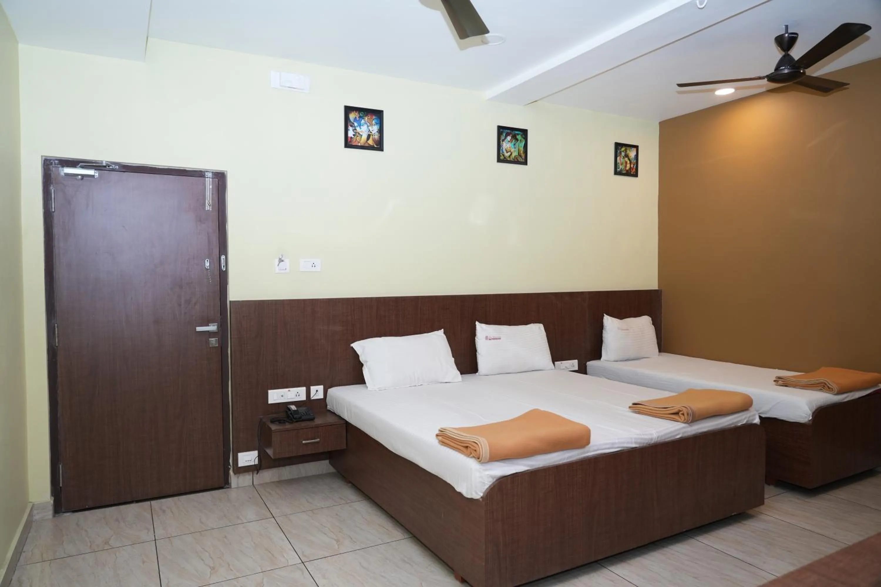 Photo of the whole room, Bed in Sri Krishnan Residency