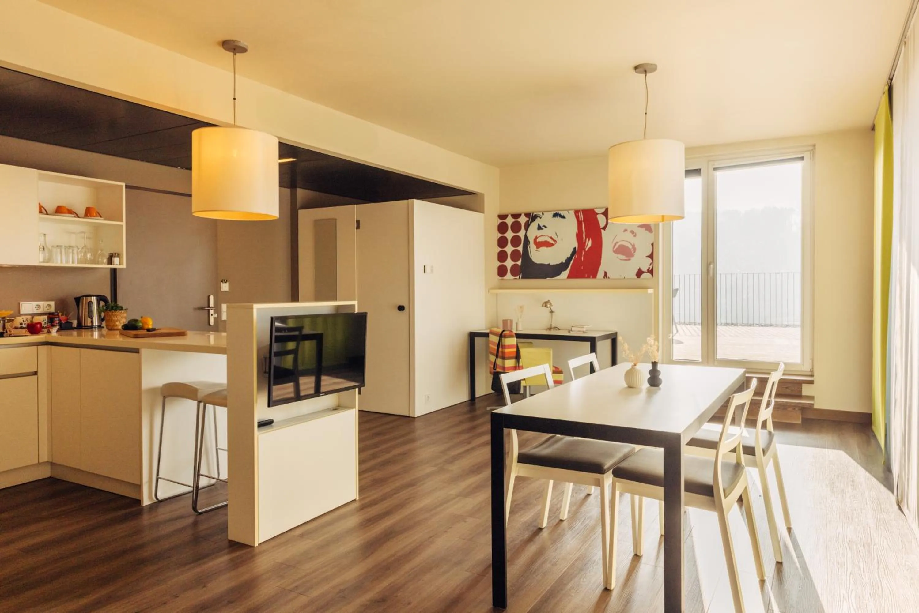 Kitchen or kitchenette in harry's home Hart bei Graz hotel & apartments