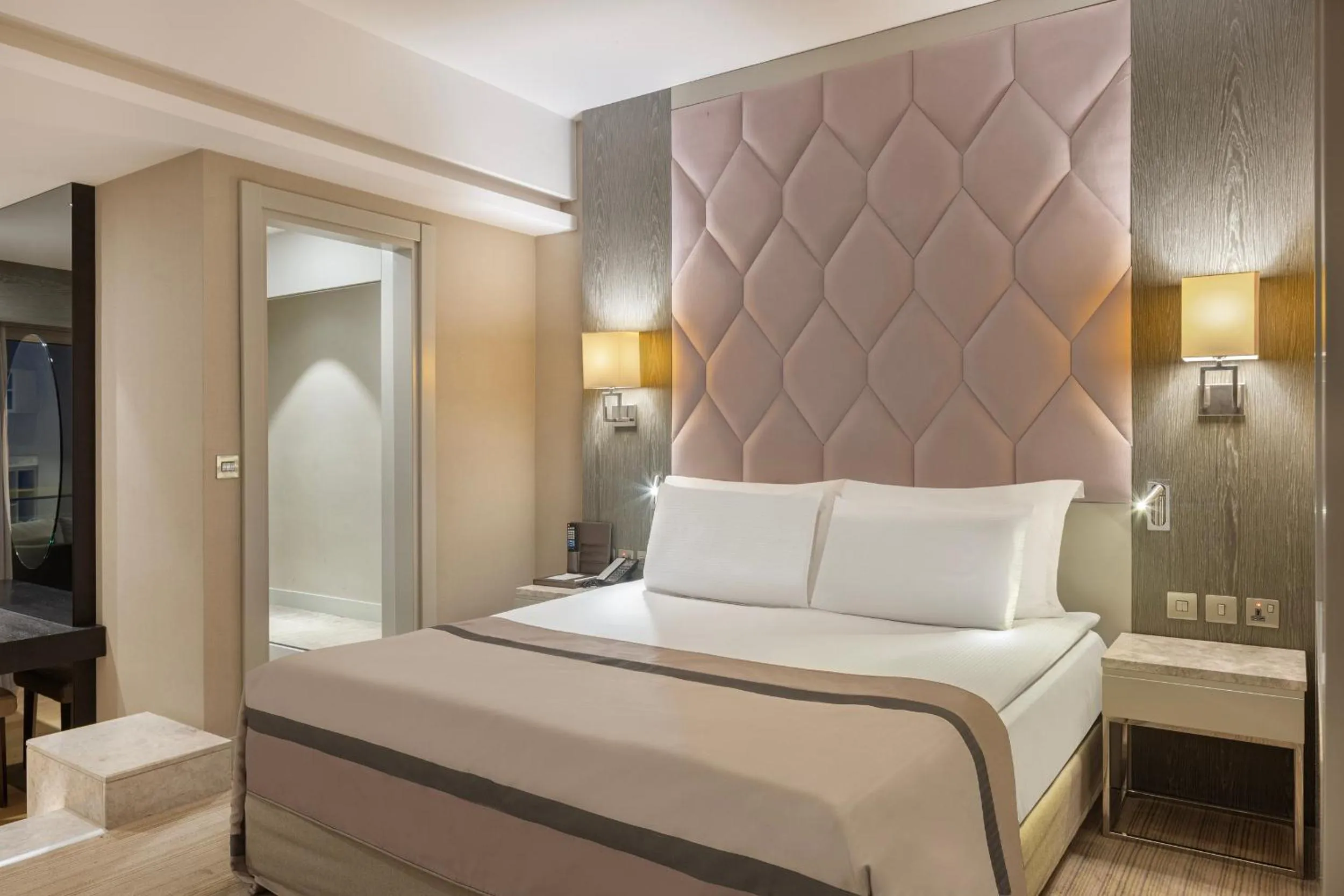 Bed in Elexus Hotel Resort & Spa & Casino