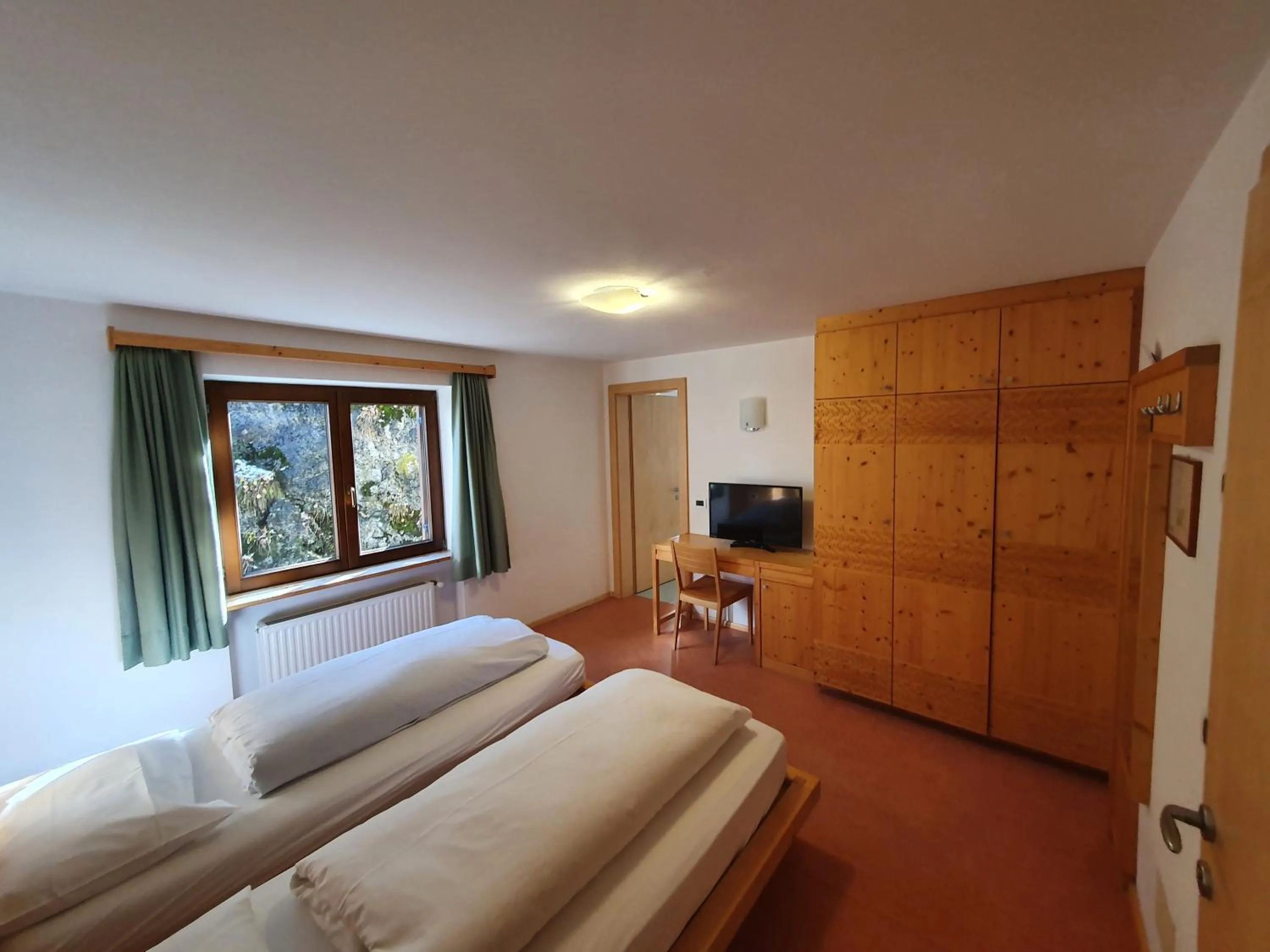 Bed in ALBERGO BAR RISTORANTE DOLOMIA