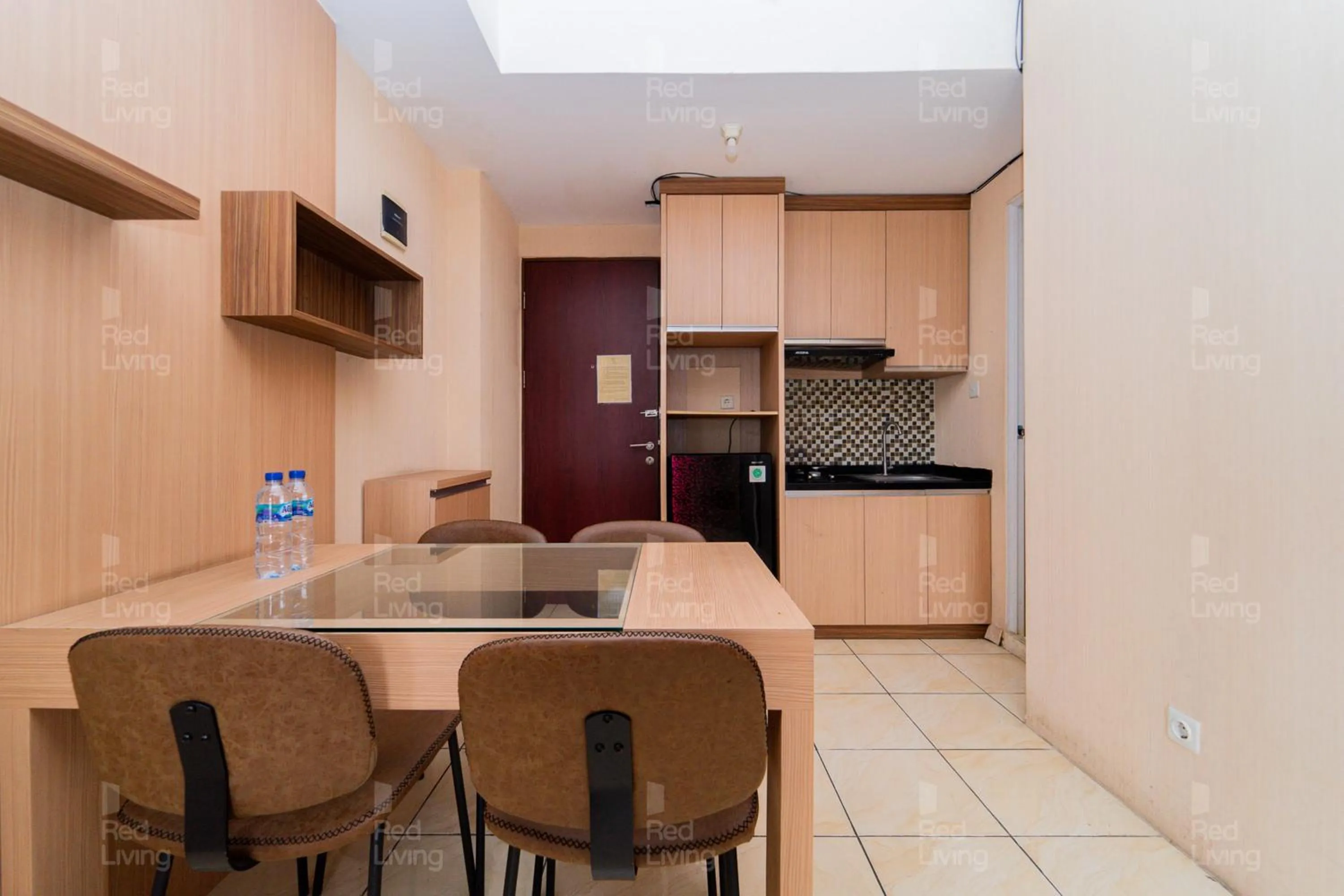 Kitchen or kitchenette in RedLiving Apartemen Tamansari Panoramic - Narel