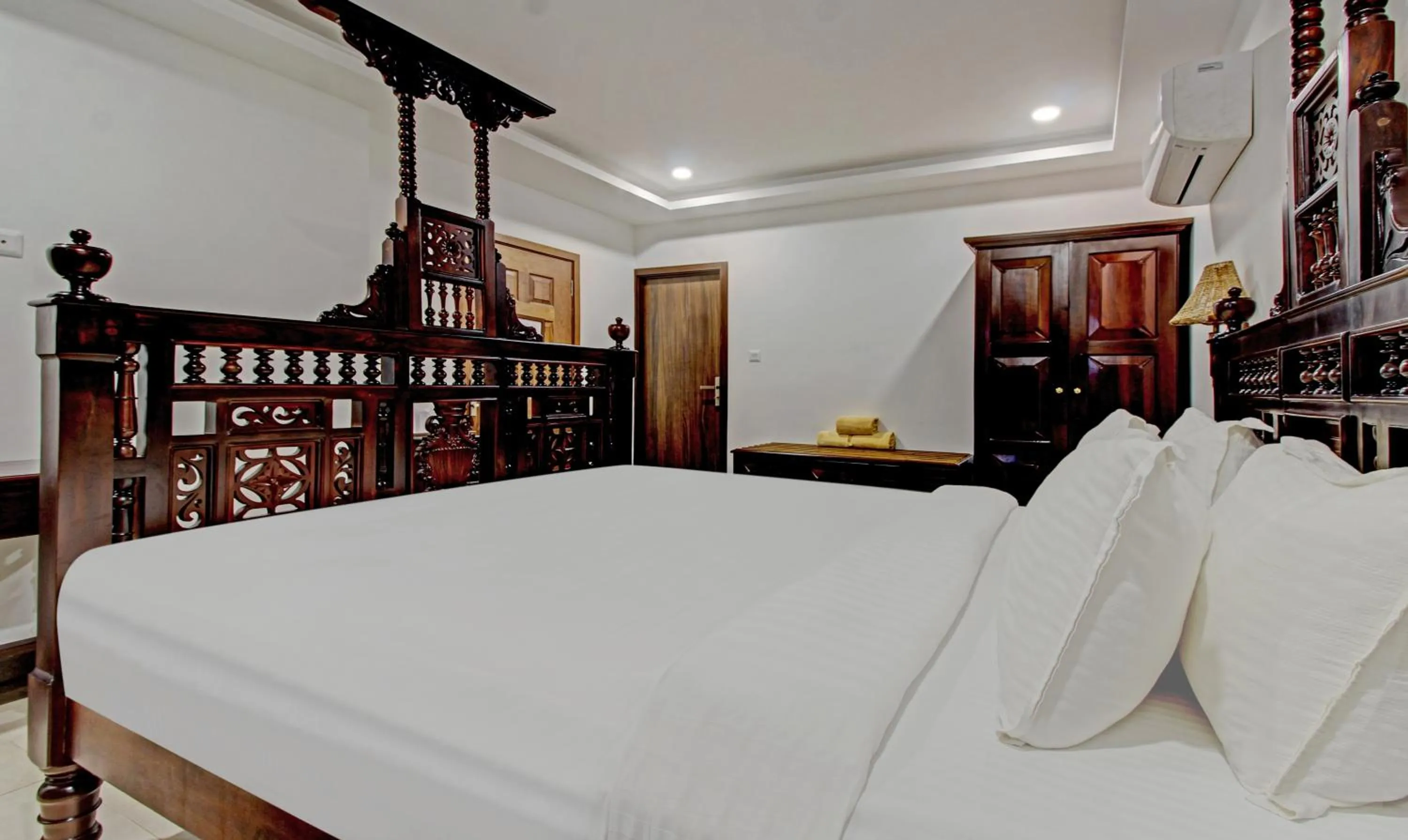 Bedroom, Bed in Treebo Premium Travancore Palace Cherthala